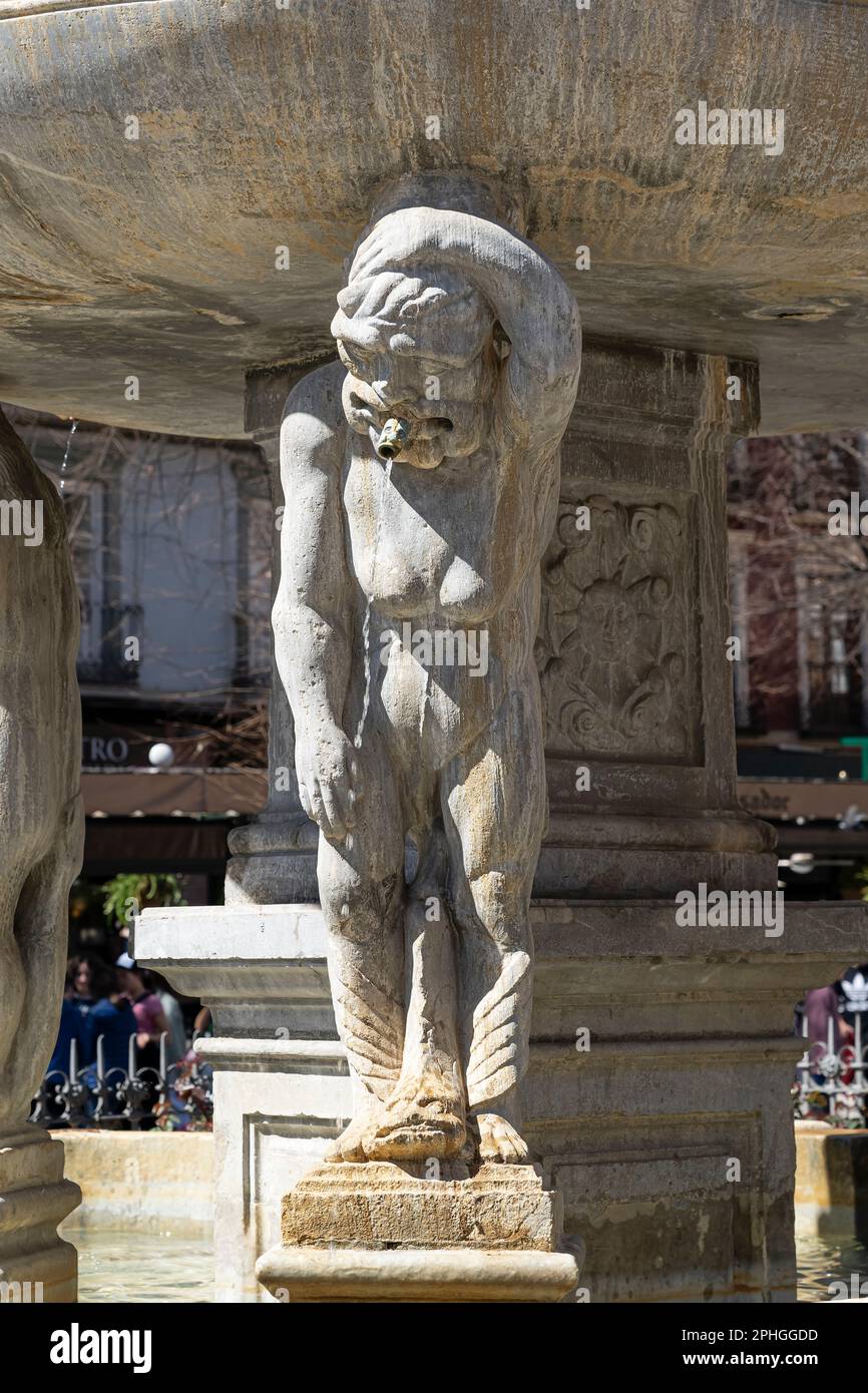 Statue forming part of the Neptune Fountain in the Plaza de Bib Rambla in Granada Spain Stock Photo