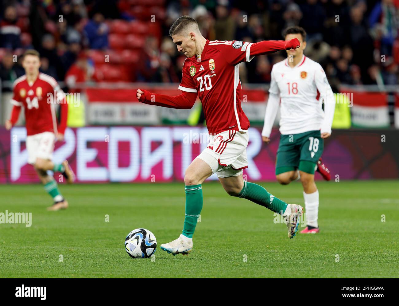 BUDAPEST, HUNGARY - MARCH 27:  Roland Sallai of Hungary runs with the ballduring the UEFA EURO 2024 qualifying round group B match between Hungary and Bulgaria at Puskas Arena on March 27, 2023 in Budapest, Hungary. Stock Photo