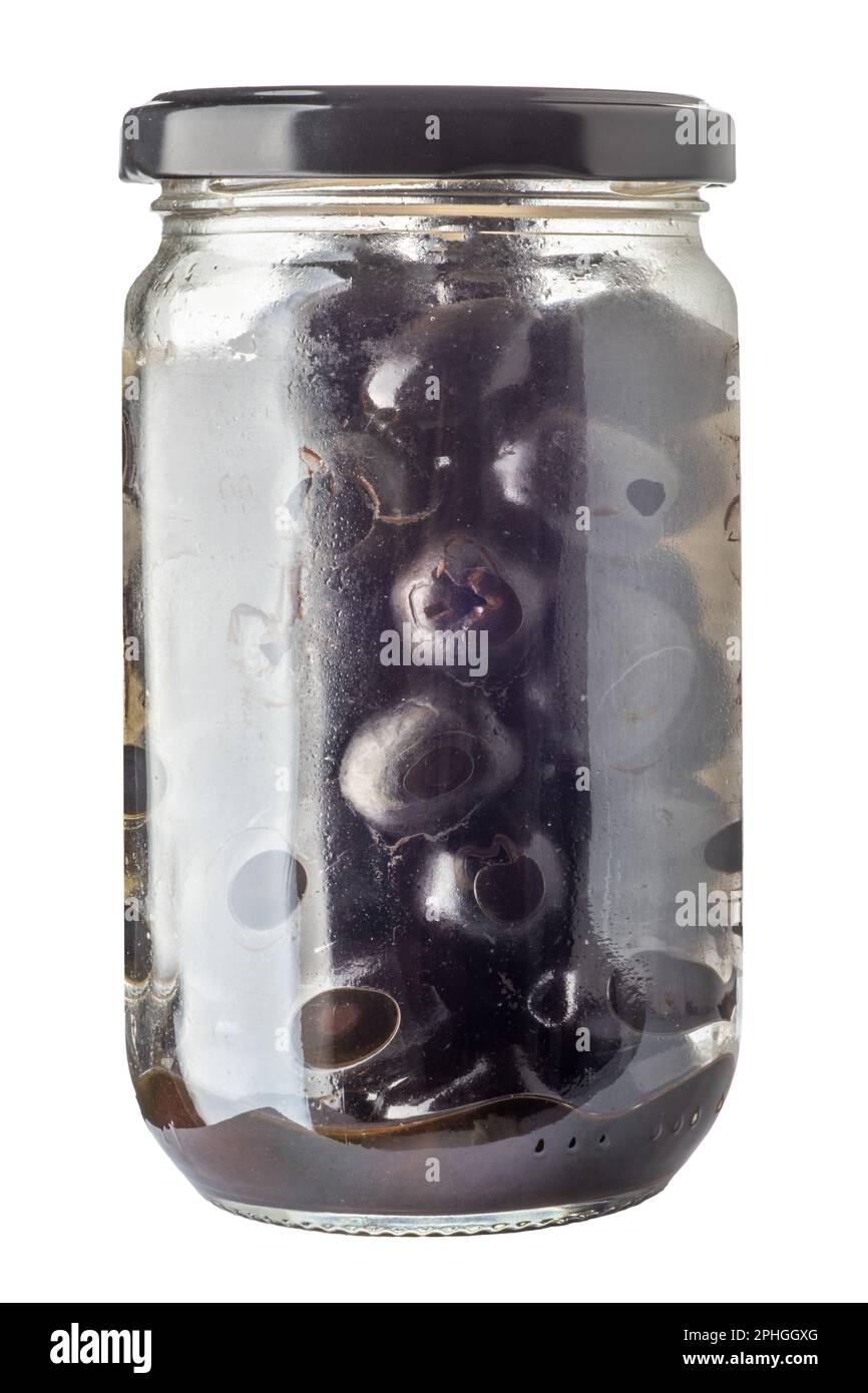 Pitted black olives preserved in glass jar, isolated on white with clipping path included Stock