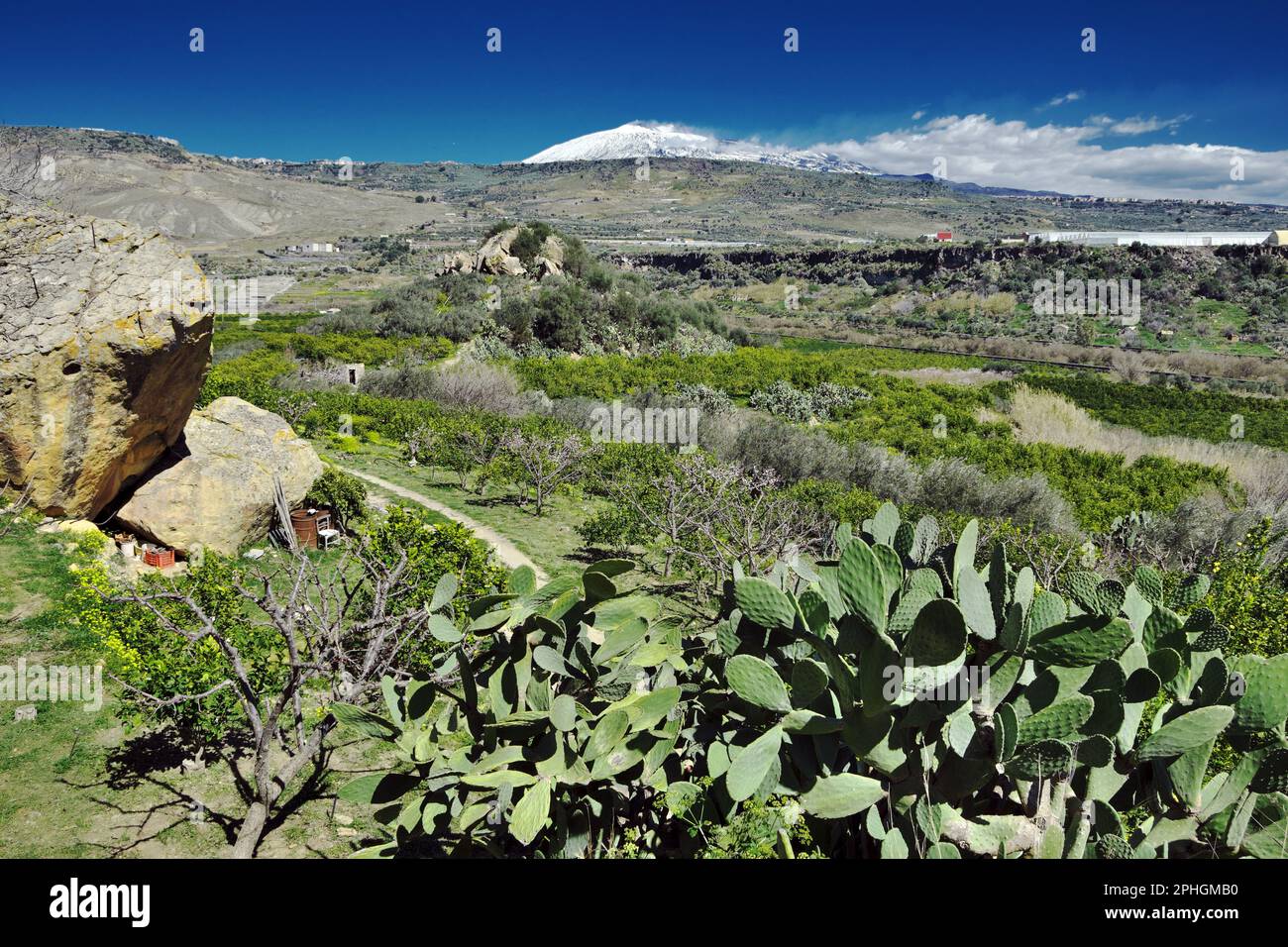 spring in Sicily landscape with Mount Etna covered in white snow ...