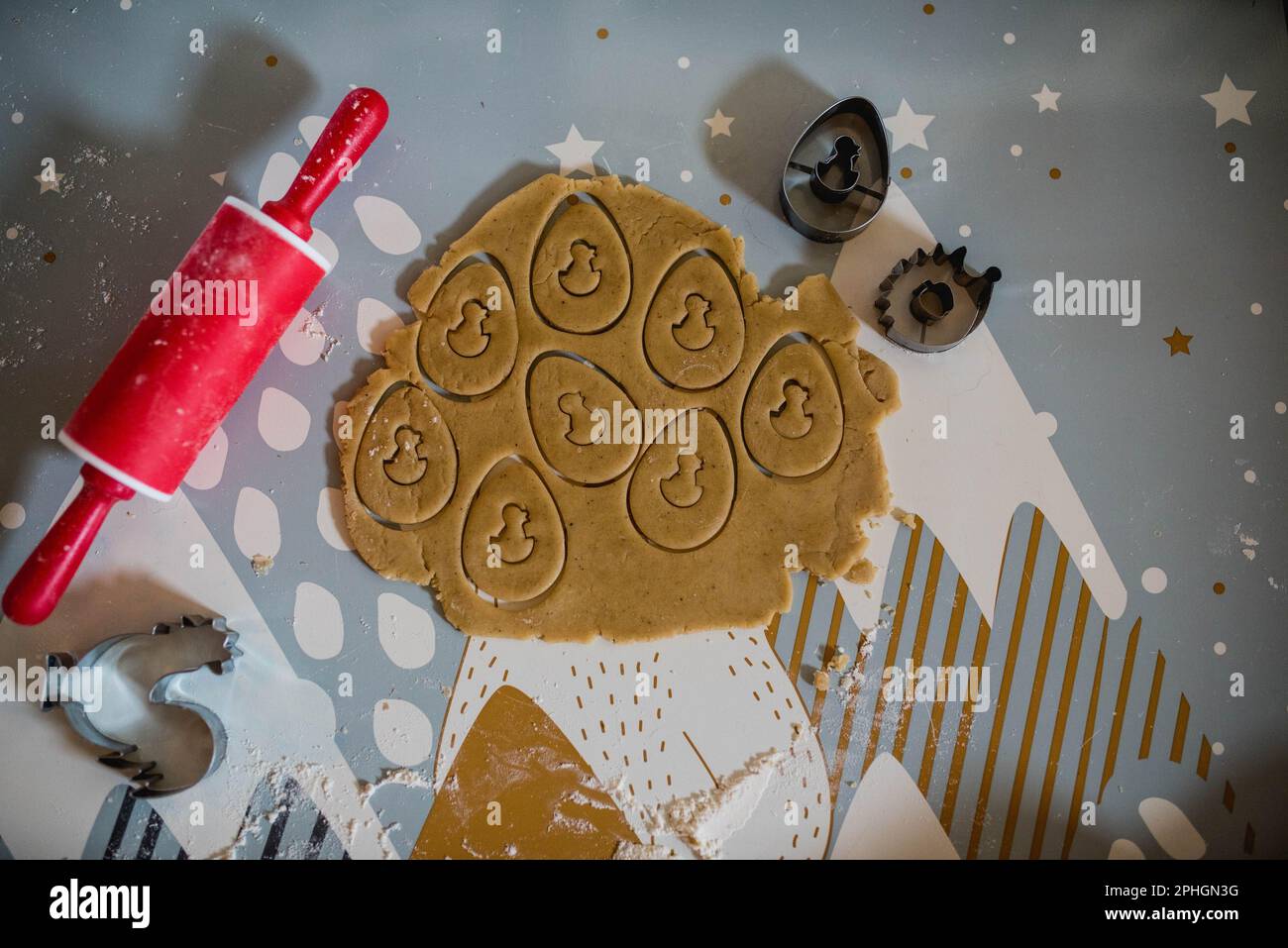 baking gingerbread with an Easter motif, baking with children, children's rolling pin, cookie cutters Stock Photo