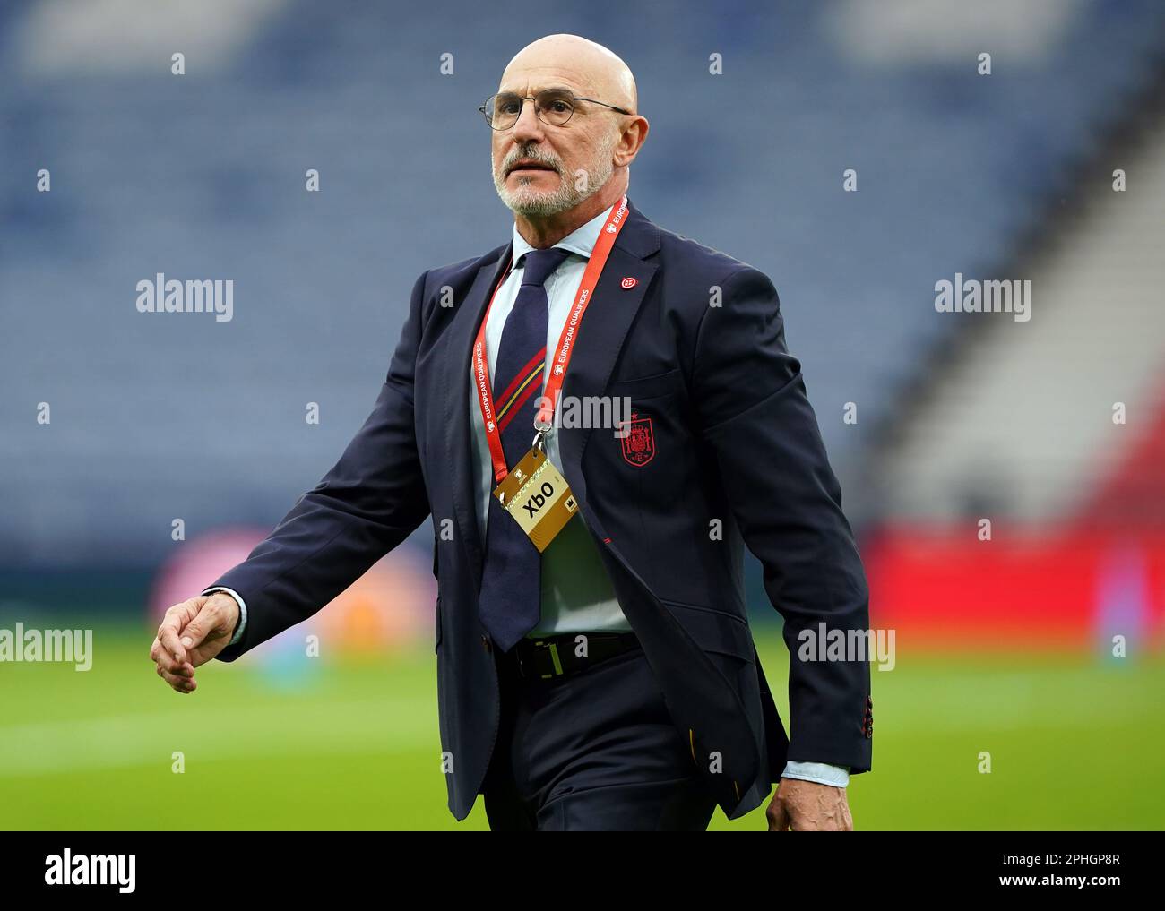 Spain manager Luis de la Fuente inspects the pitch ahead of the UEFA
