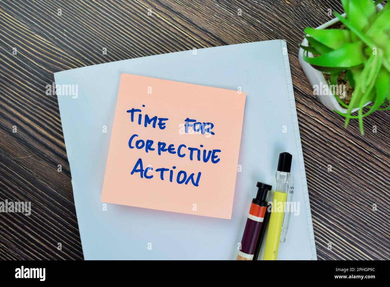 Concept of Time For Corrective Action write on sticky notes isolated on Wooden Table. Stock Photo