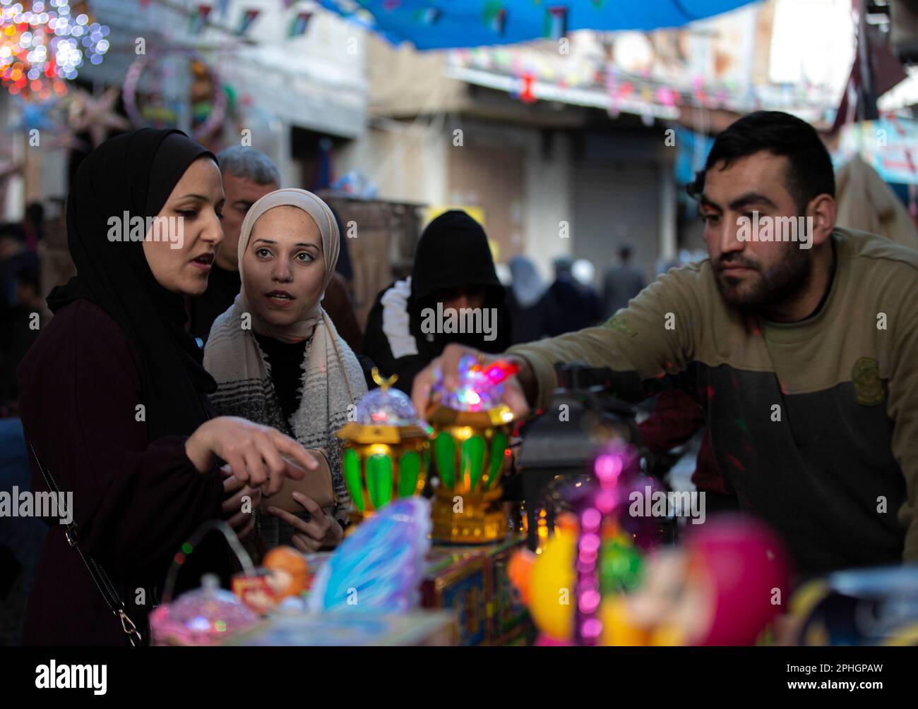 Palestinians shop for decorations at the old Zawiya market in Gaza City, in preparation for the holy month of Ramadan. Gaza Strip. Palestine. Stock Photo