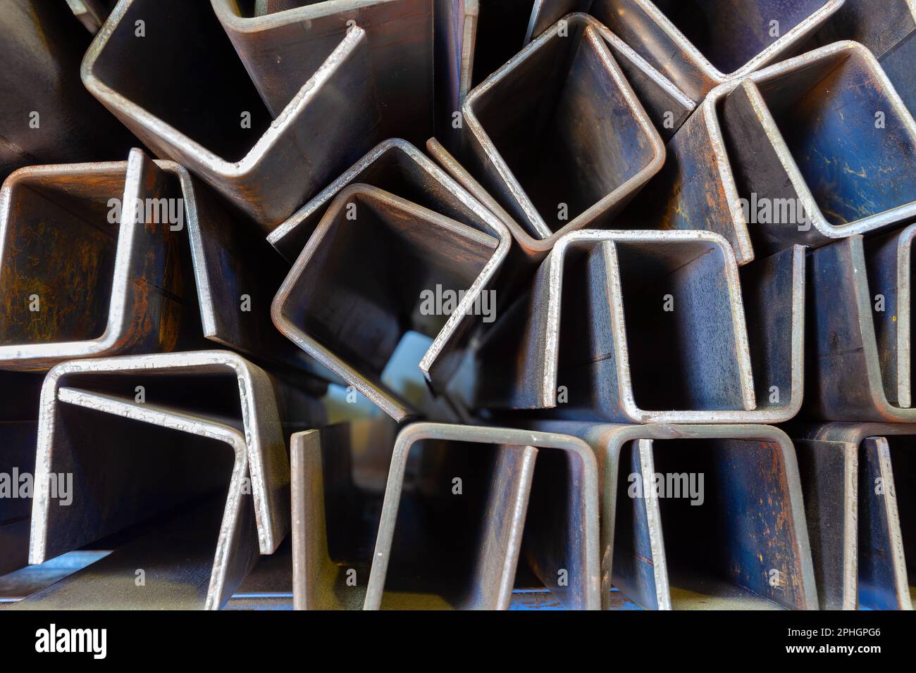 Rack with metal profiles closeup for background. Stock Photo