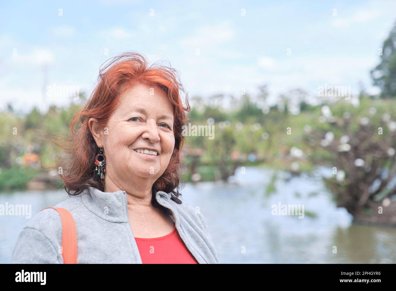 Mature woman camera outdoors hi-res stock photography and images - Alamy