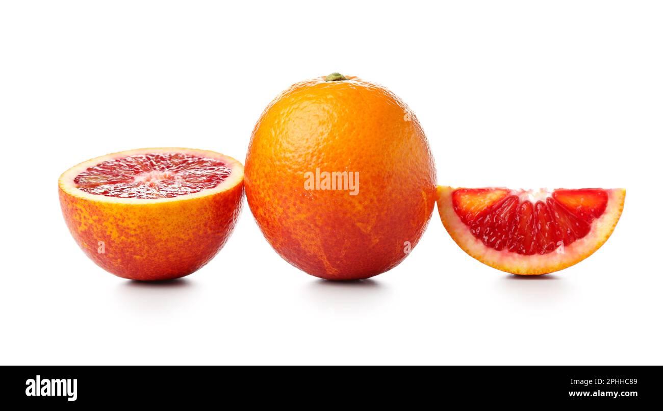 Tasty cut and whole blood oranges on white background Stock Photo Alamy