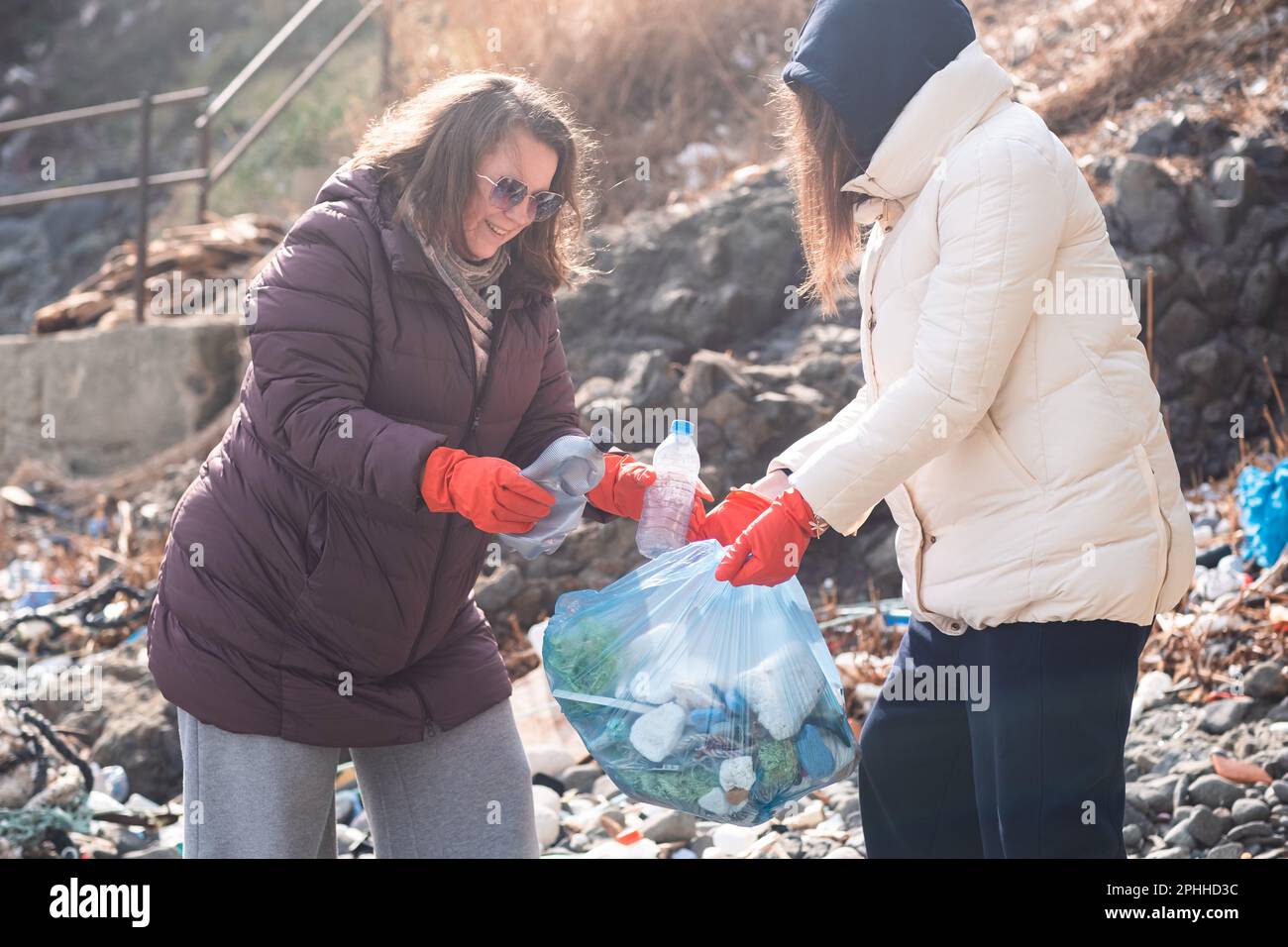 volunteers taking action against ocean plastic problem. Collect waste ...