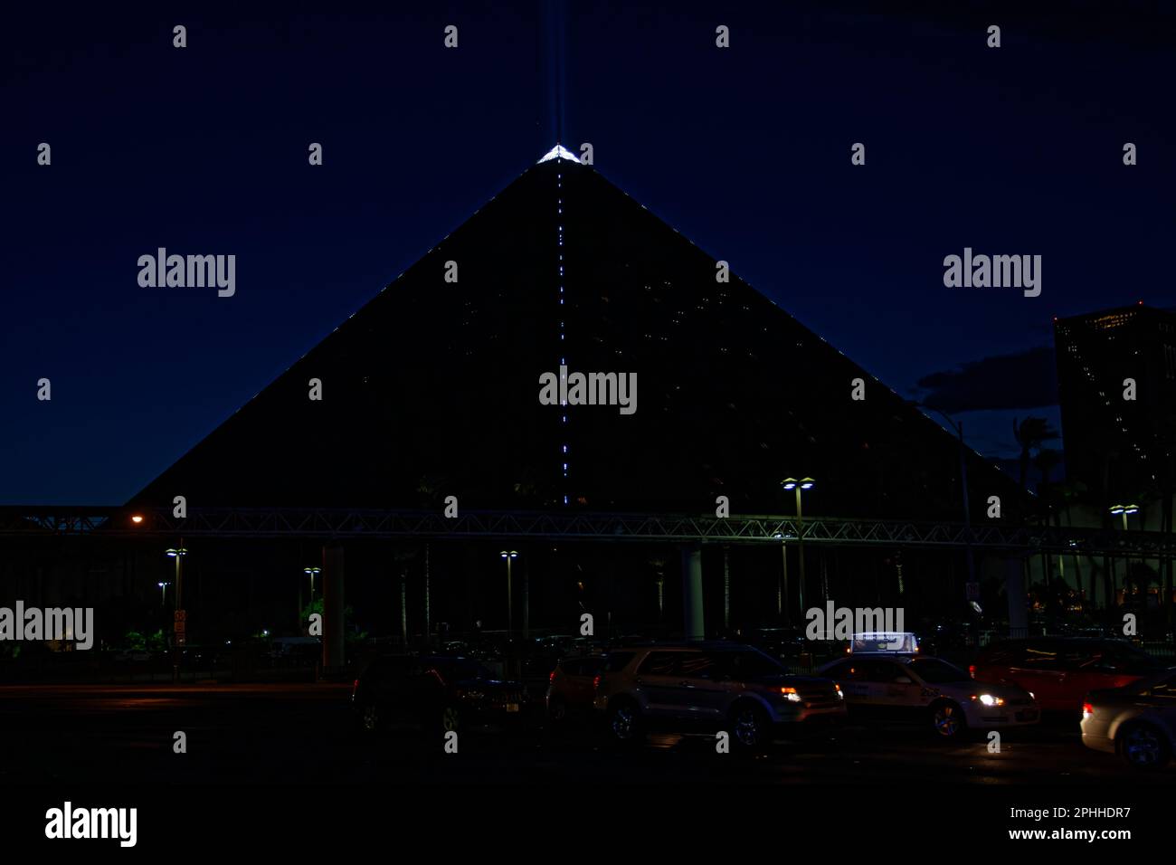 Luxor Hotel & Casino at night, emitting the famous light beam Stock Photo