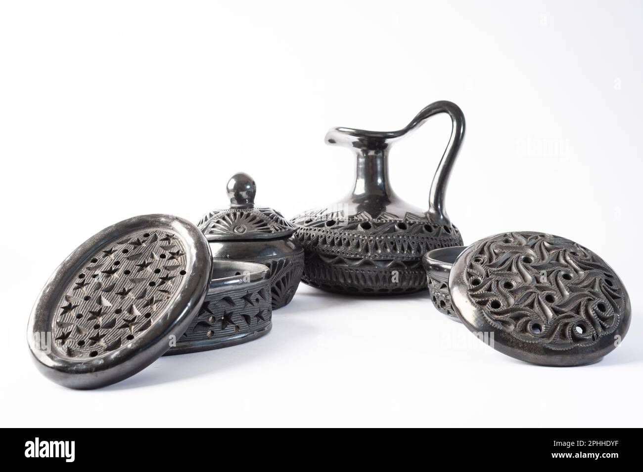 Typical Mexican handicraft. Set of black clay pots of different shapes ...