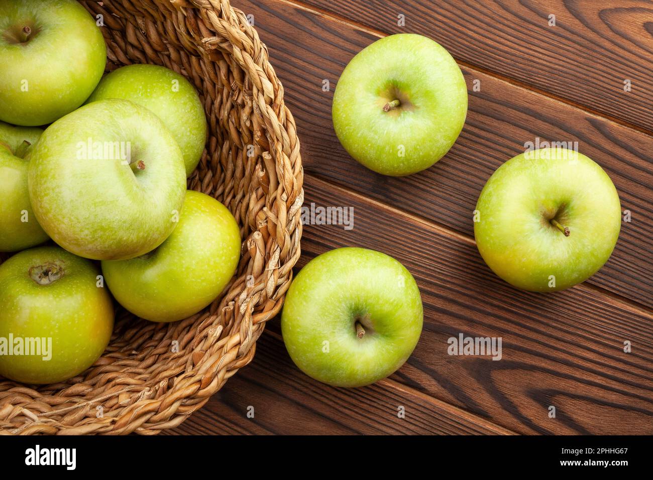 green apples on wood background Stock Photo