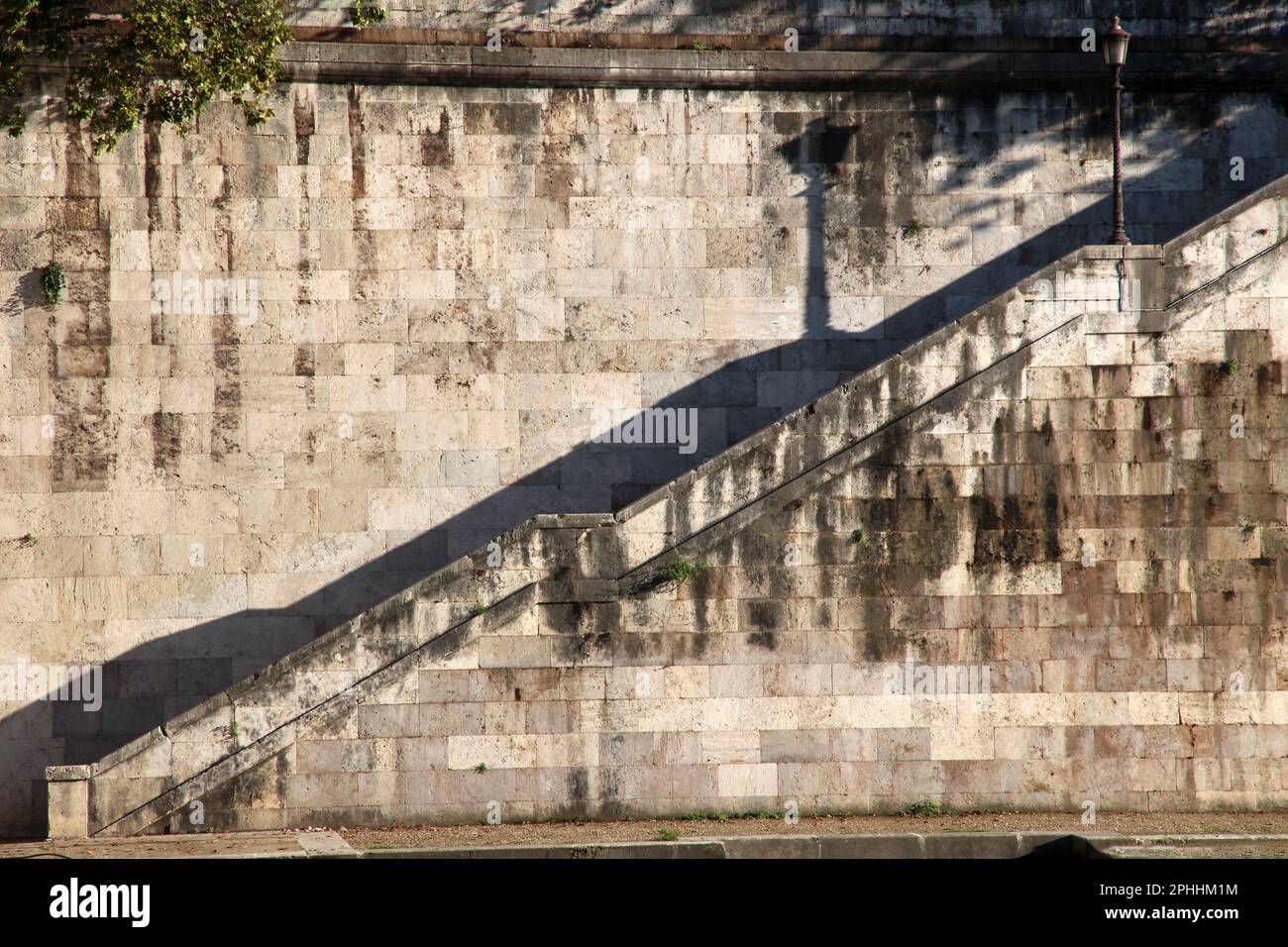 Roman cityscape with shadows and parapets, Lungotevere, Roma, Italy Stock Photo