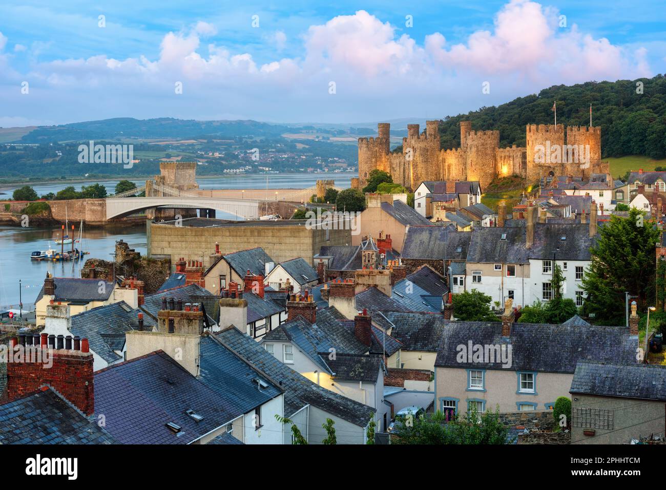 View over the roofs of historical Conwy Old town to the Conwy castle, North Wales, UK Stock Photo