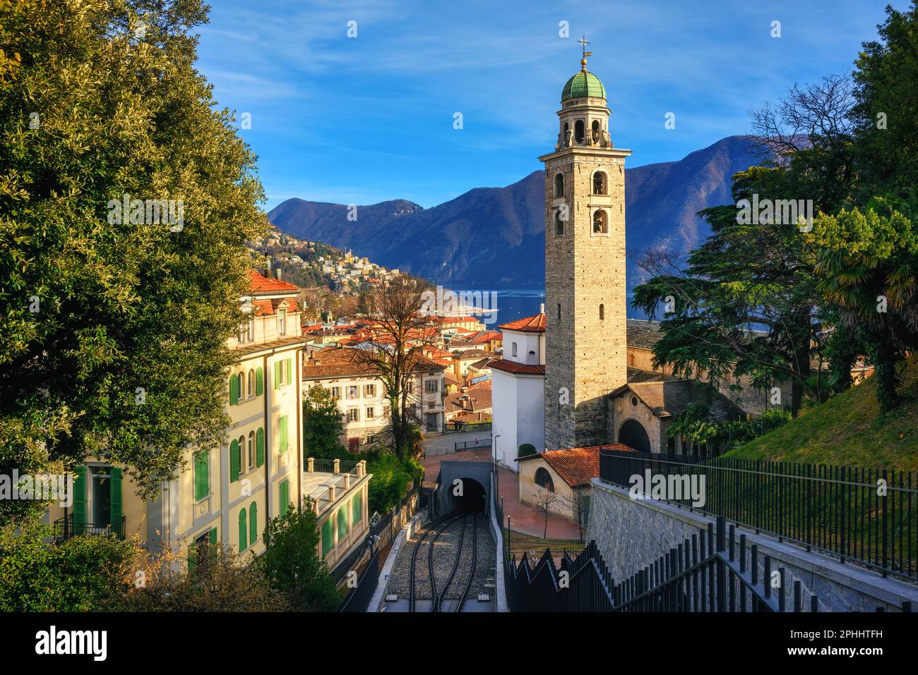 Lugano city, view of the Cathedral, Lake Lugano and surrounding Alps mountains, Ticino, Switzerland Stock Photo