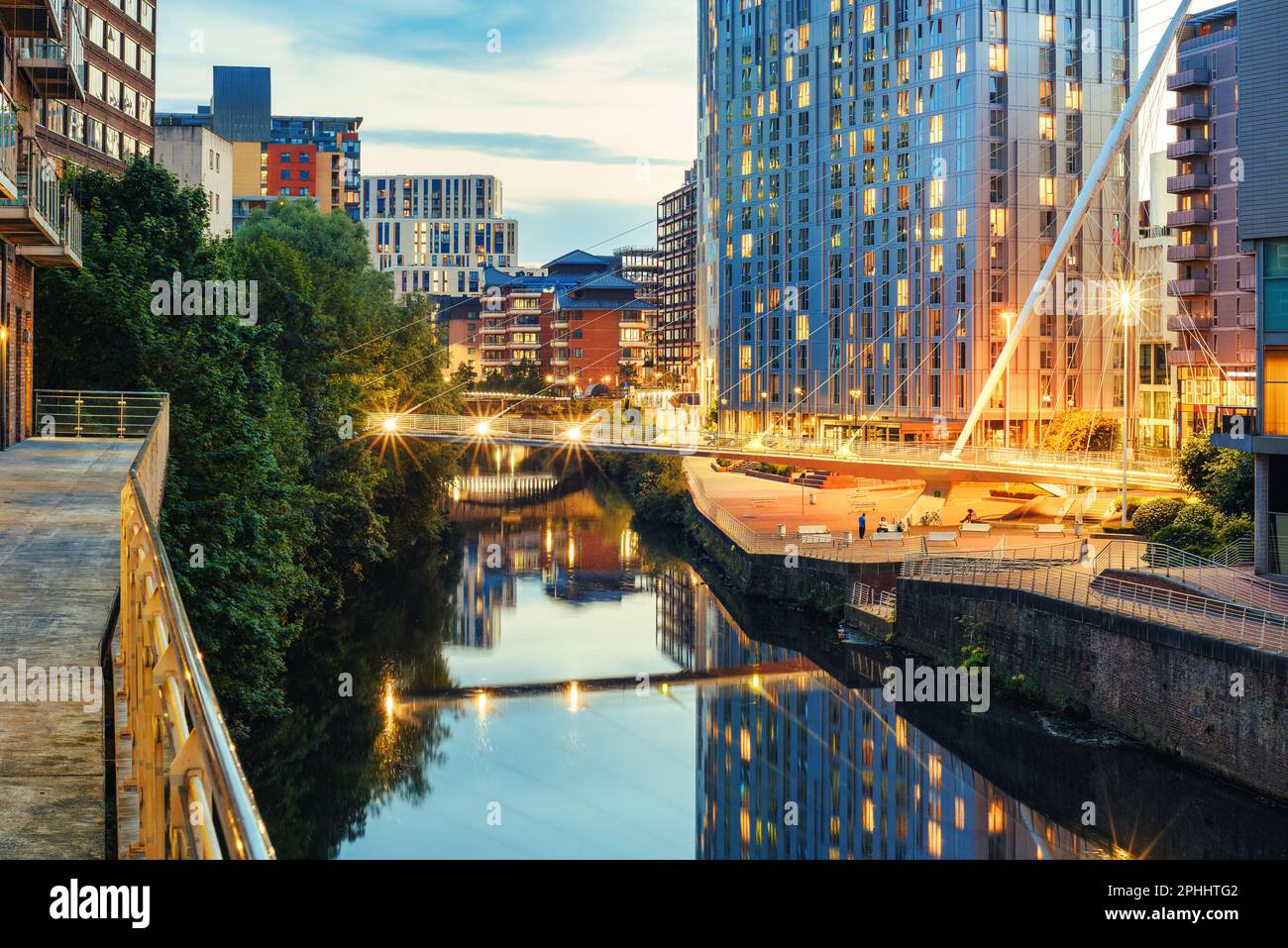 River Irwell banks in Manchester City Centre, England, illuminated in the evening Stock Photo
