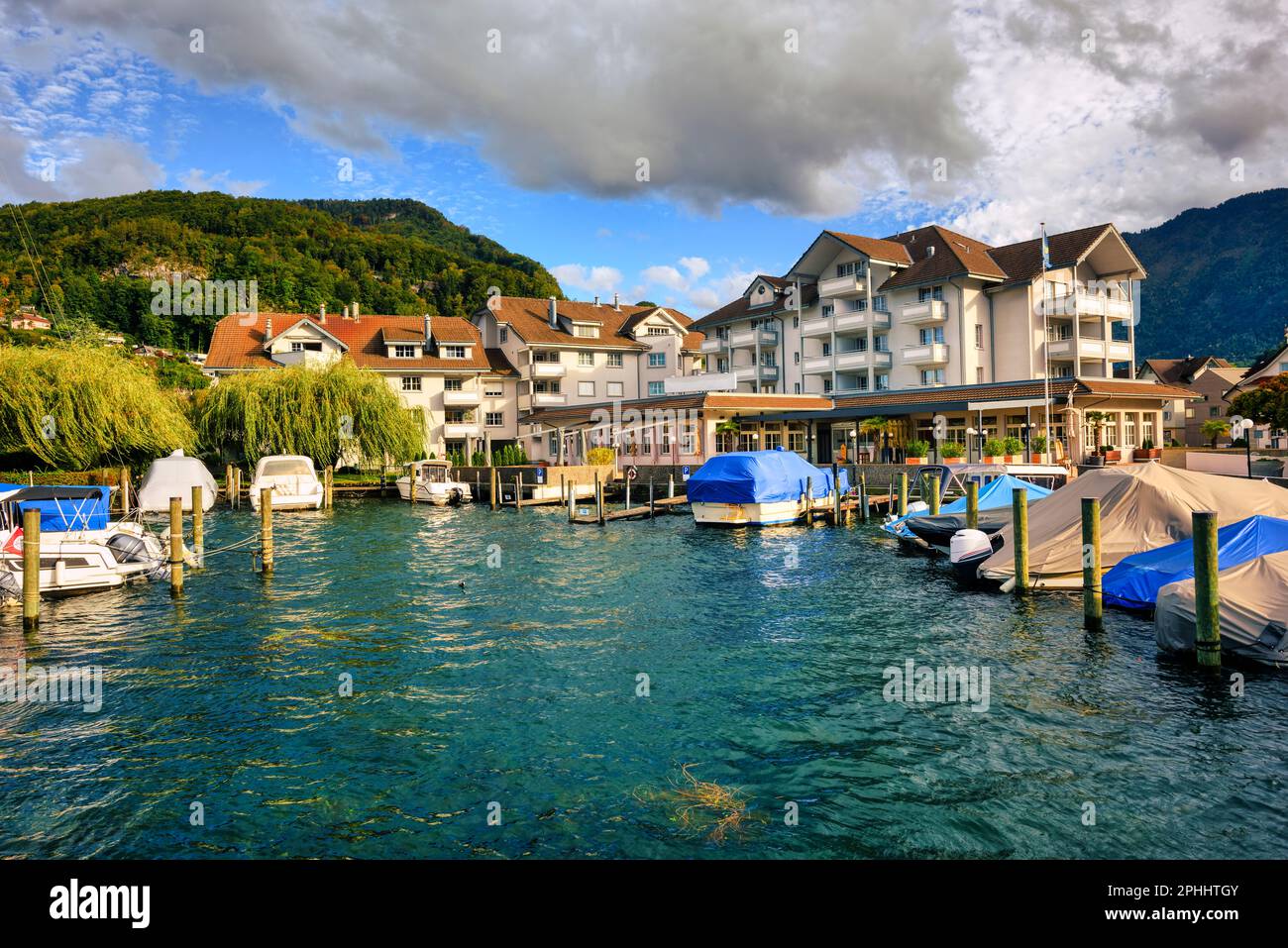Yacht harbor on Lake Lucerne in Stansstad town, Alps mountains, Nidwalden canton, Switzerland Stock Photo
