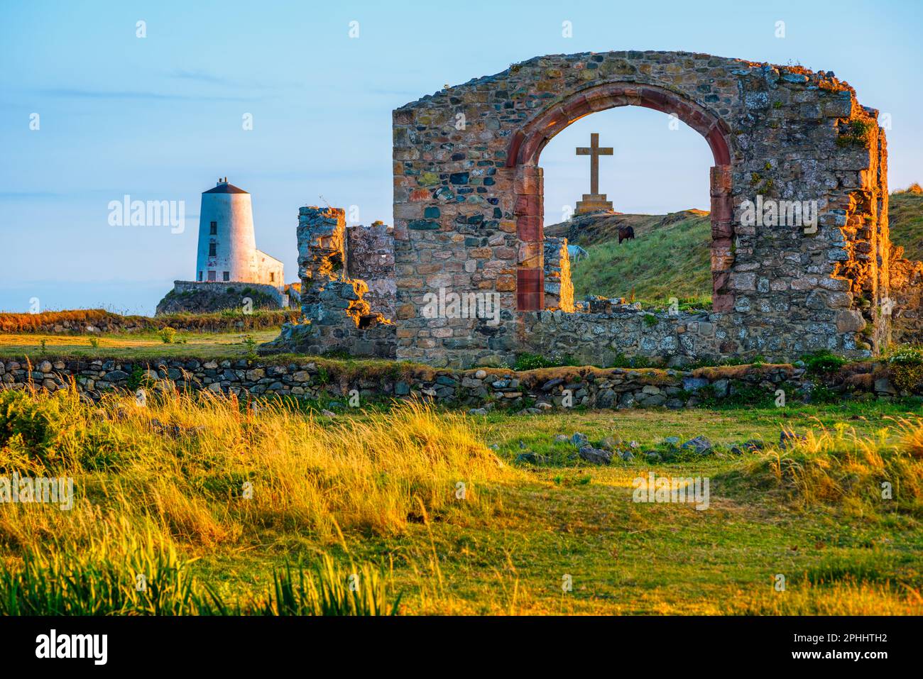 Picturesque Twr Mawr Lighthouse and the ruins of historical St Dwynwen's Church, Anglesey island, Wales Stock Photo