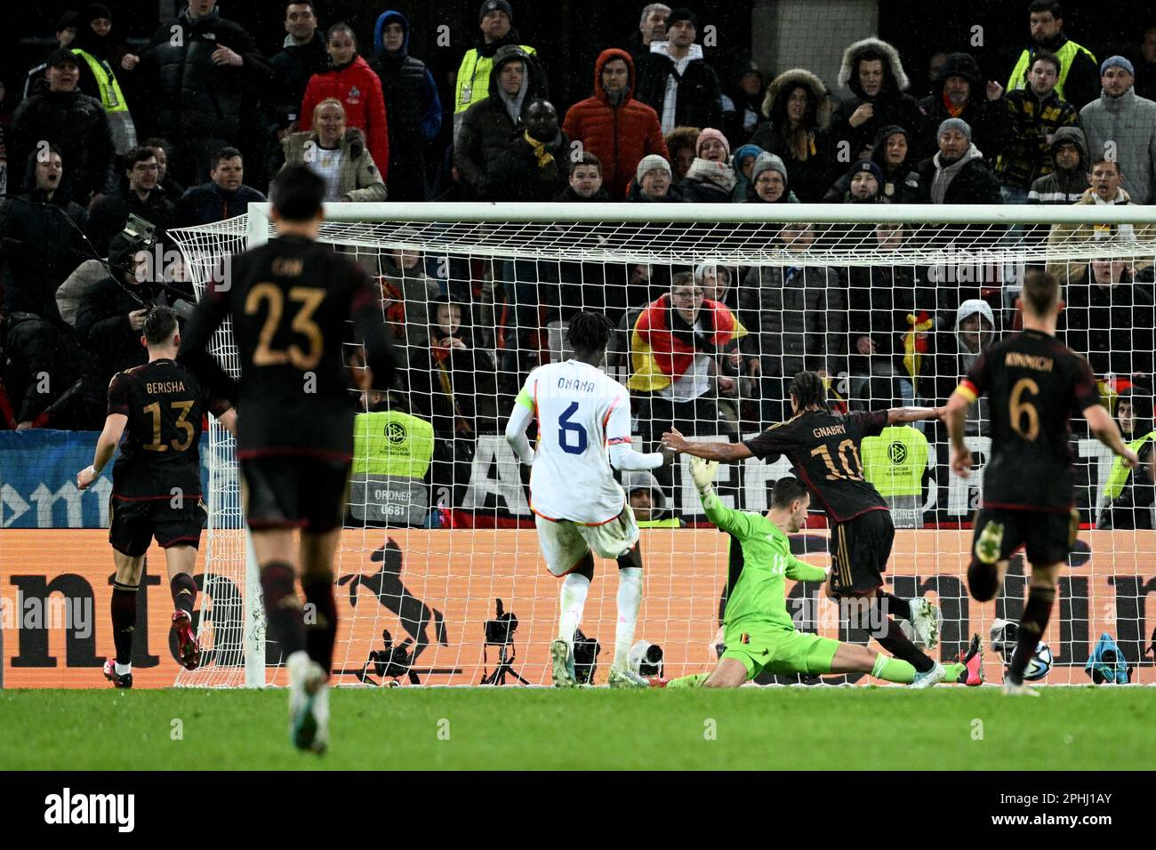 Cologne, Germany. 28th Mar, 2023. Soccer: International match, Germany - Belgium, RheinEnergieStadion. Germany's Serge Gnabry (2nd from right) scores the goal to make it 2:3. Credit: Federico Gambarini/dpa/Alamy Live News Stock Photo