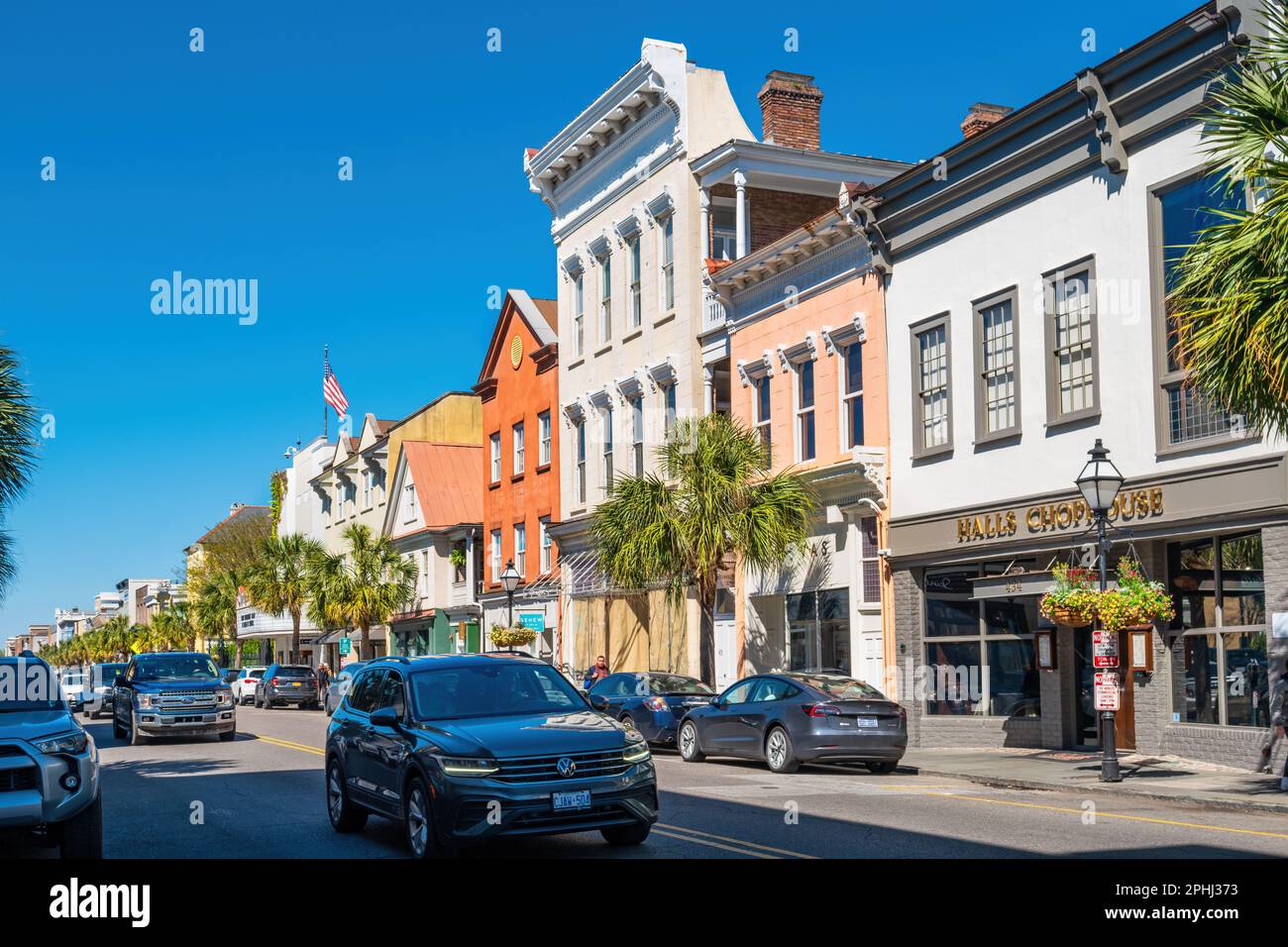 Cars pass by businesses on King Street in downtown Charleston, South