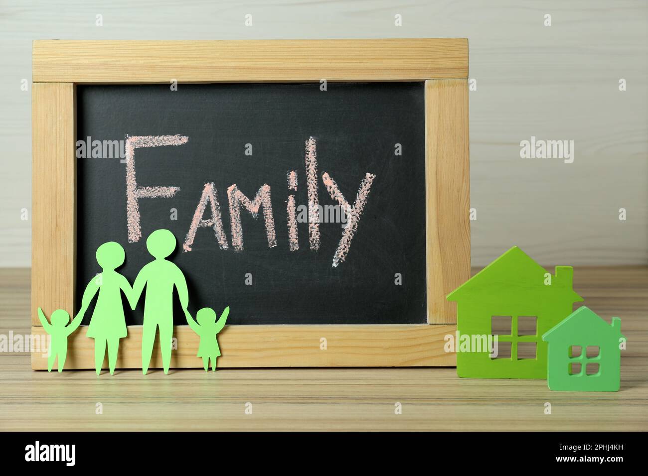 Happy Family Day. Blackboard, paper parents and their children near ...