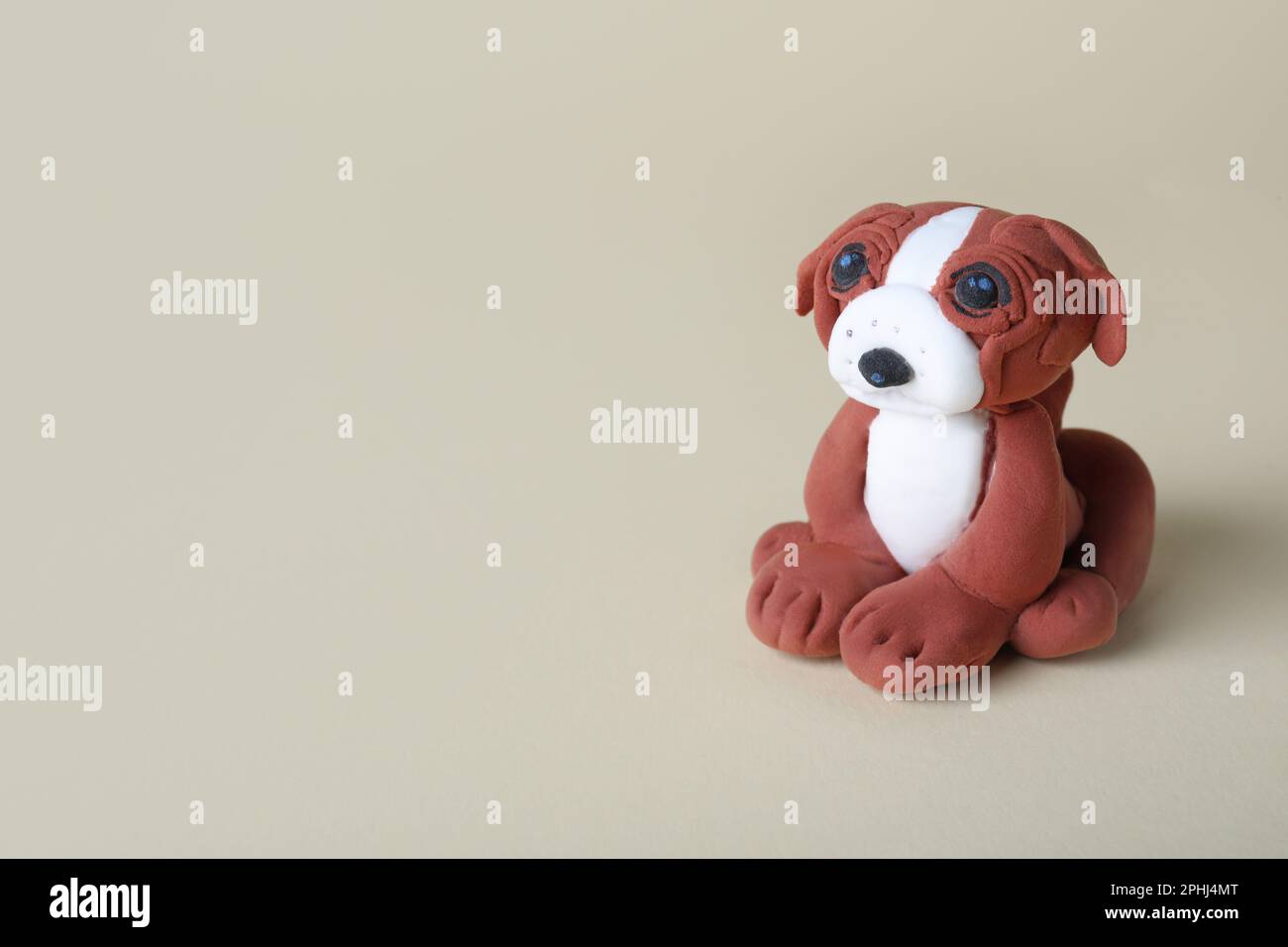 Small dog made from play dough on light grey background. Space for text  Stock Photo - Alamy