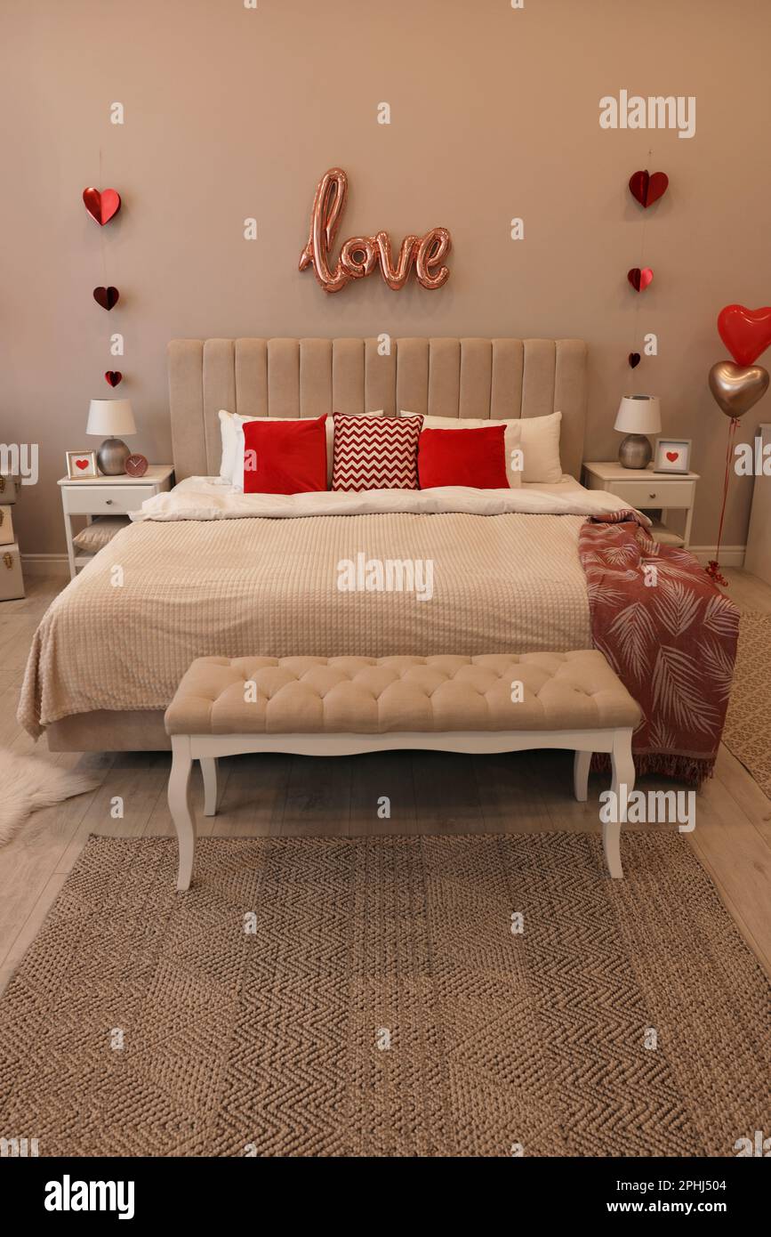 Cozy bedroom decorated for Valentine Day. Interior design Stock ...