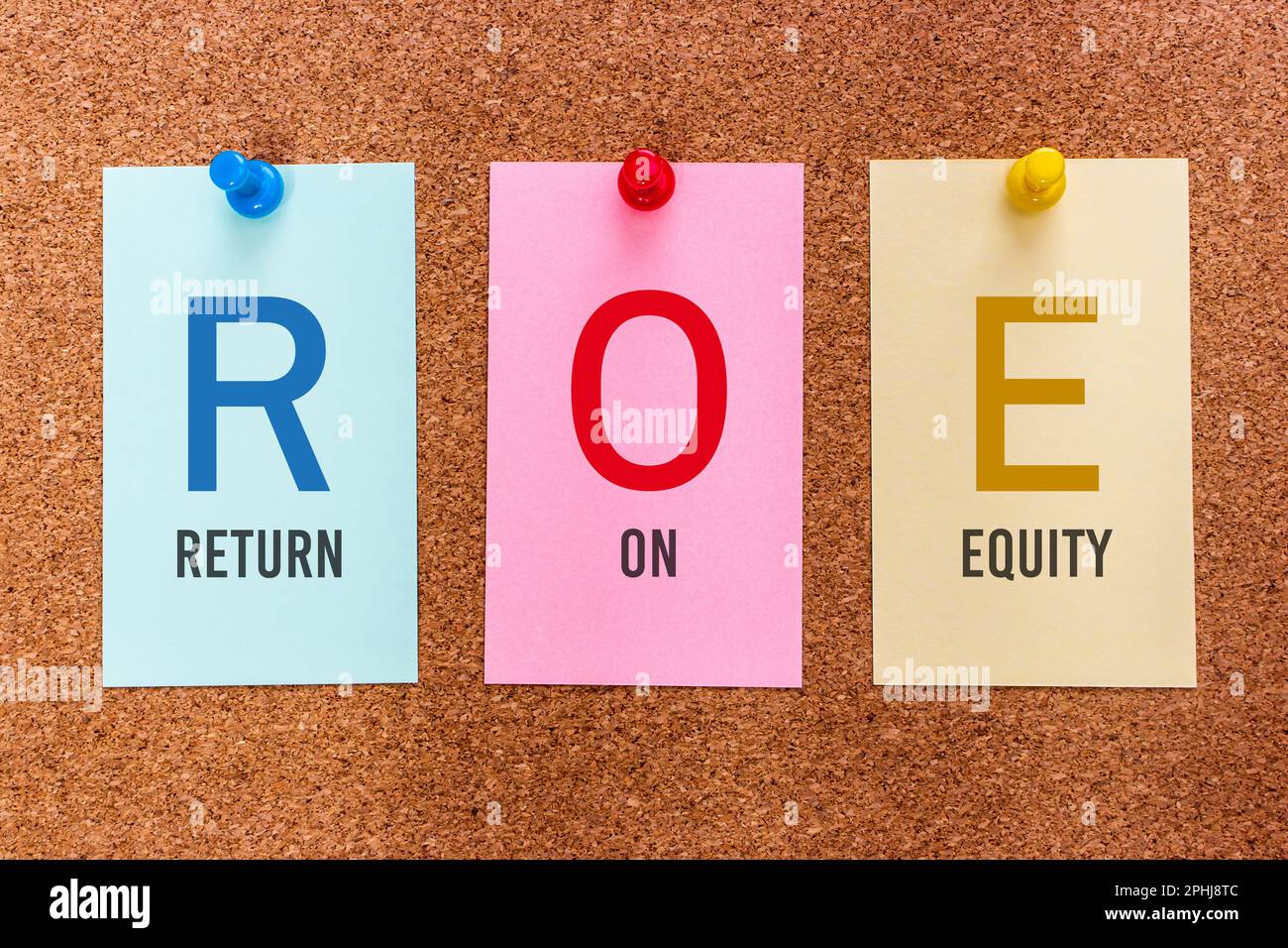 Conceptual 3 letters keyword ROE (Return on Equity), on multicolored stickers attached to a cork board. Stock Photo