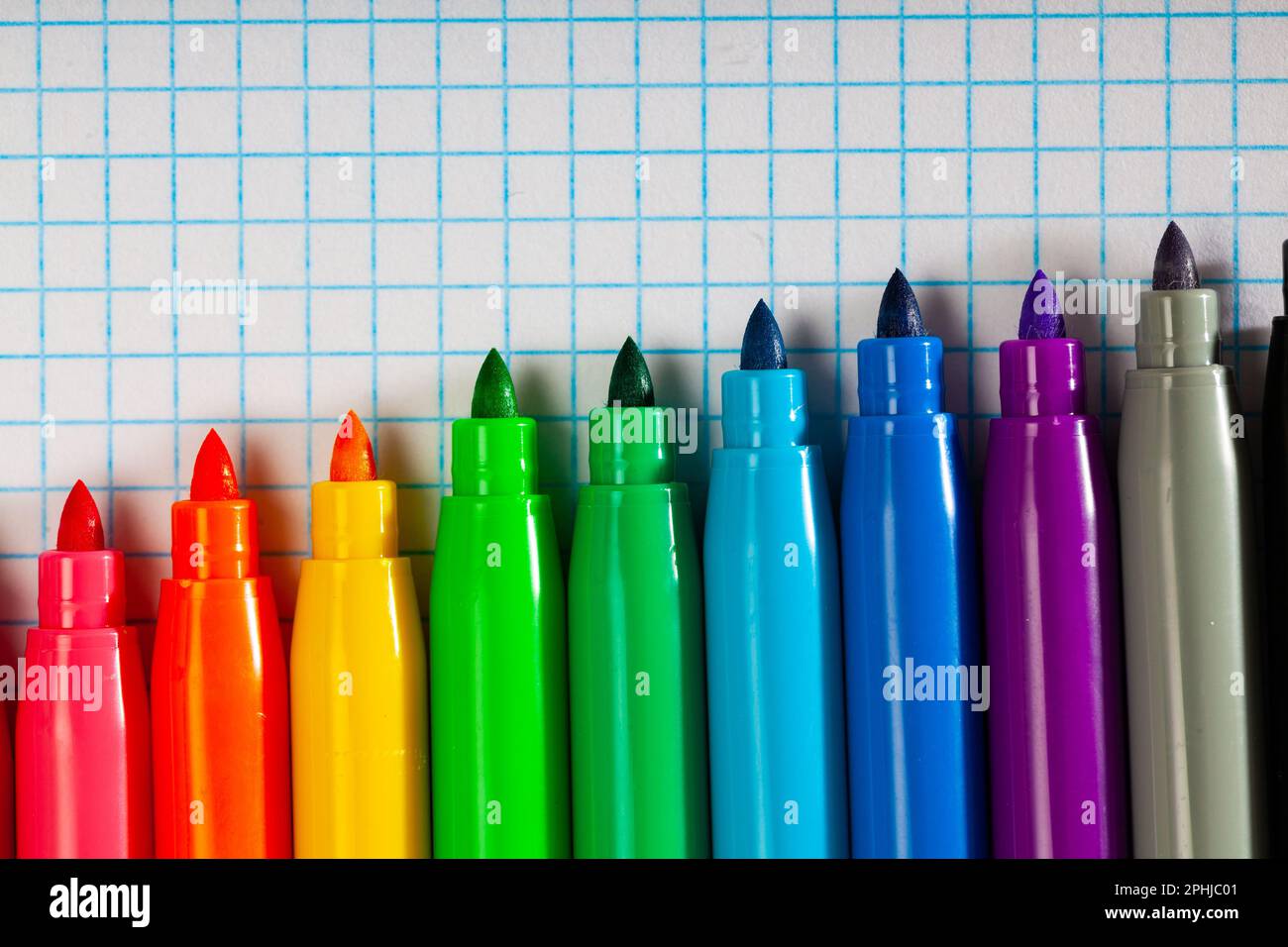 Opened multicolored markers on notebook, nobody Stock Photo