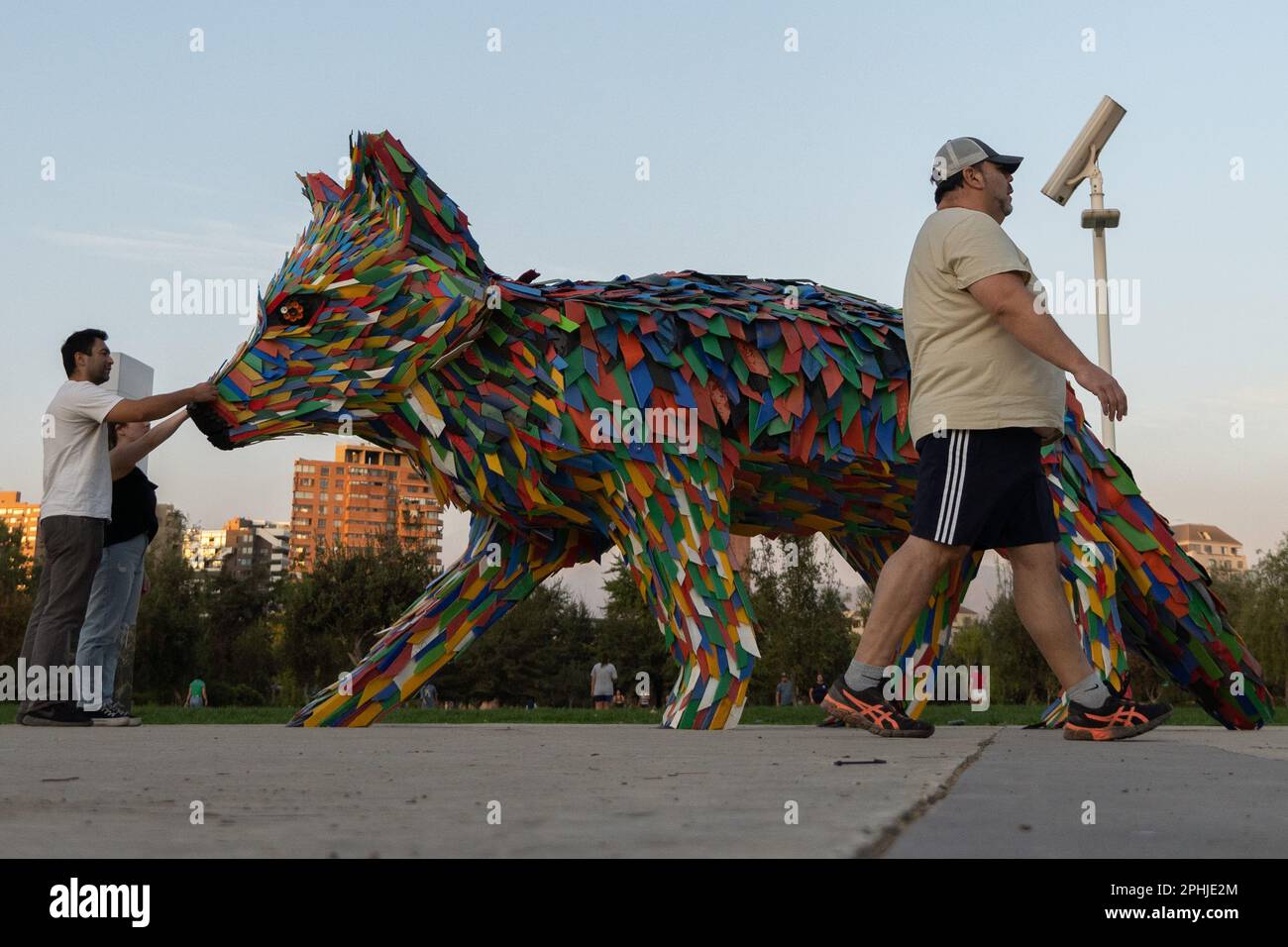 Santiago, Metropolitana, Chile. 28th Mar, 2023. People touch a fox 