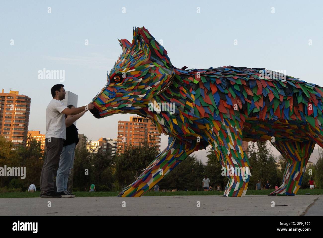 Santiago, Metropolitana, Chile. 28th Mar, 2023. People touch a fox 