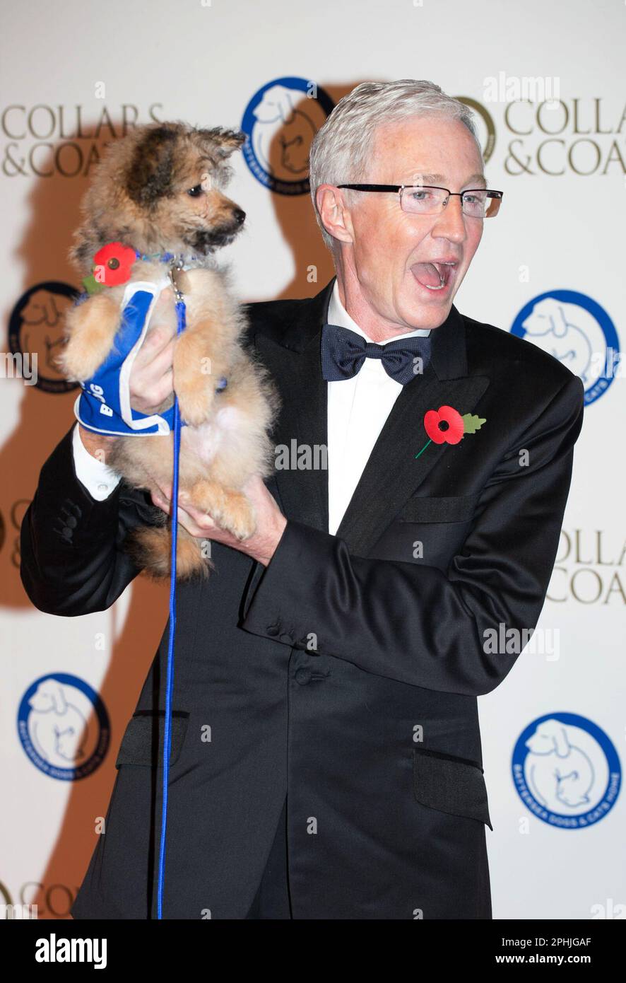 File photo dated 30/10/14 Paul O'Grady arriving at the Battersea Dogs' Collars and Coats Gala fundraising ball at the Battersea Evolution Marquee, London. TV presenter and comedian Paul O'Grady has died at the age of 67, his partner Andre Portasio has said. The TV star, also known for his drag queen persona Lily Savage, died 'unexpectedly but peacefully' on Tuesday evening, a statement shared with the PA news agency via a representative said. Issue date: Wednesday March 29, 2023. Stock Photo