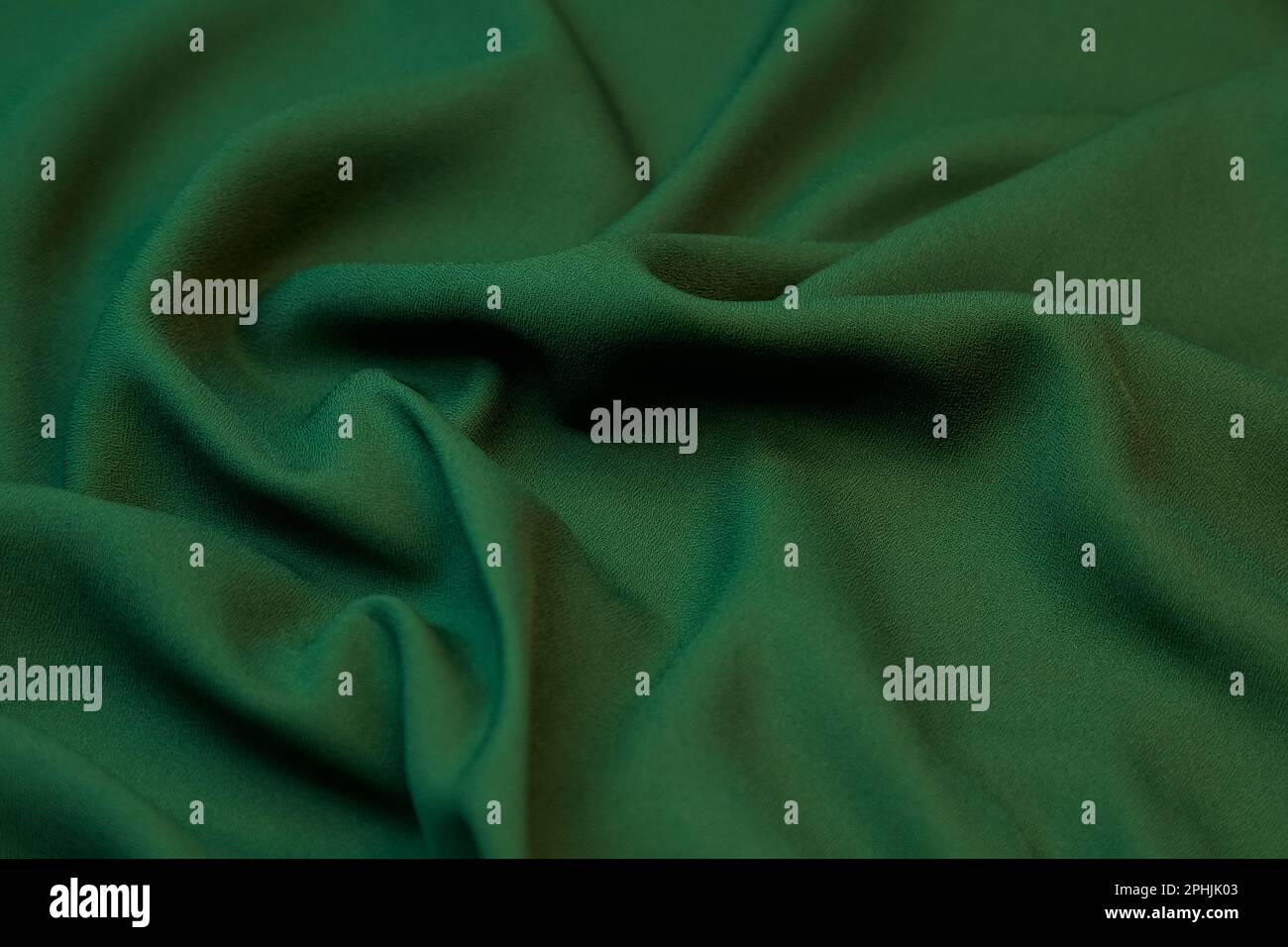 Green fabric background. Selective focus. Stock Photo