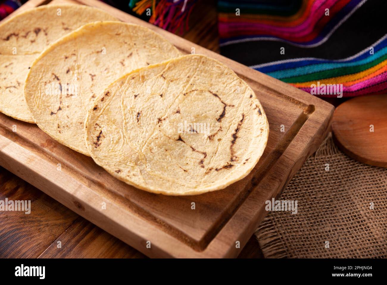 Corn Tortillas. Food made with nixtamalized corn, a staple food in several American countries, an essential element in many Latin American dishes. Stock Photo