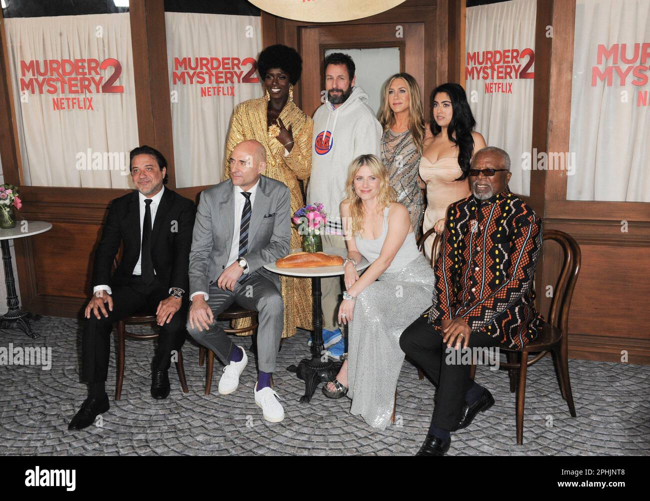 Los Angeles, USA. 28th Mar, 2023. (L-R) MURDER MYSTERY 2 Cast - Enrique  Arce, Jodie Turner-Smith, Mark Strong, Adam Sandler, Jennifer Aniston,  Mélanie Laurent, Kuhoo Verma and Dr. John Kani at the