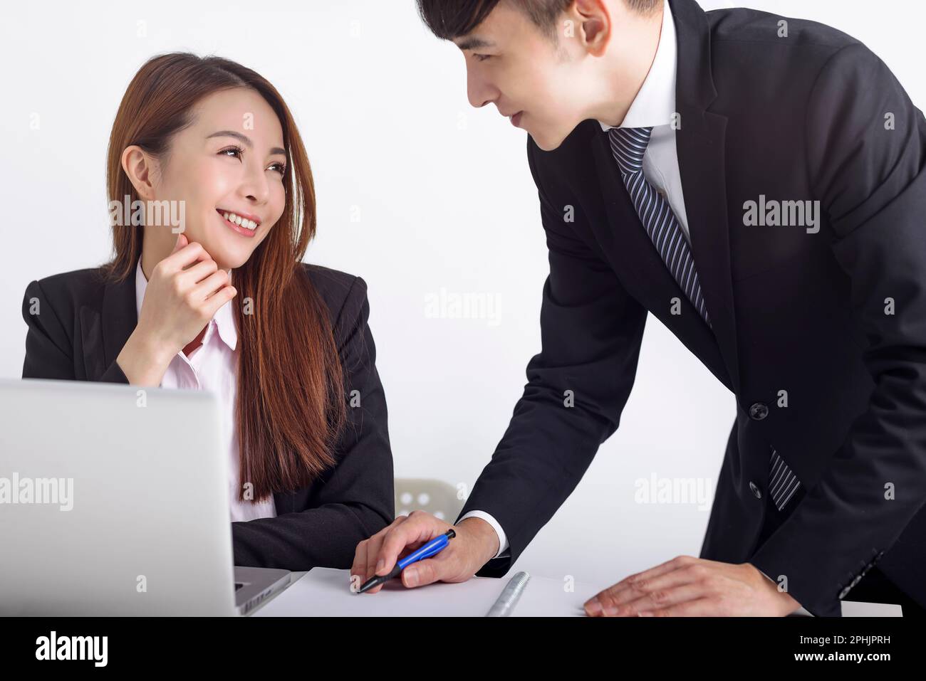 Business team using laptop and working together in office Stock Photo ...