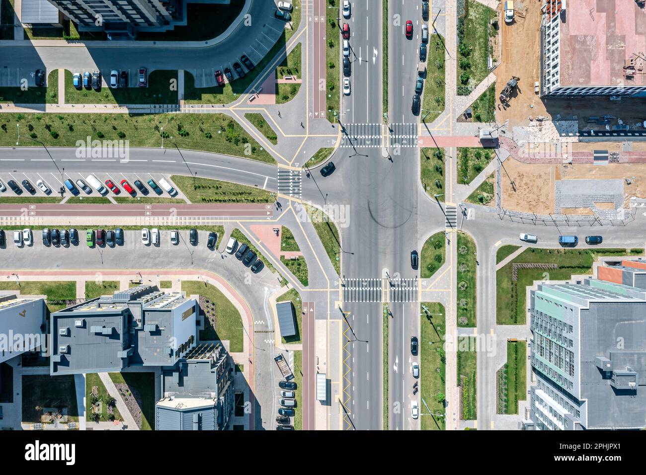 aerial top view on the crossroad in the city at sunny summer day Stock Photo