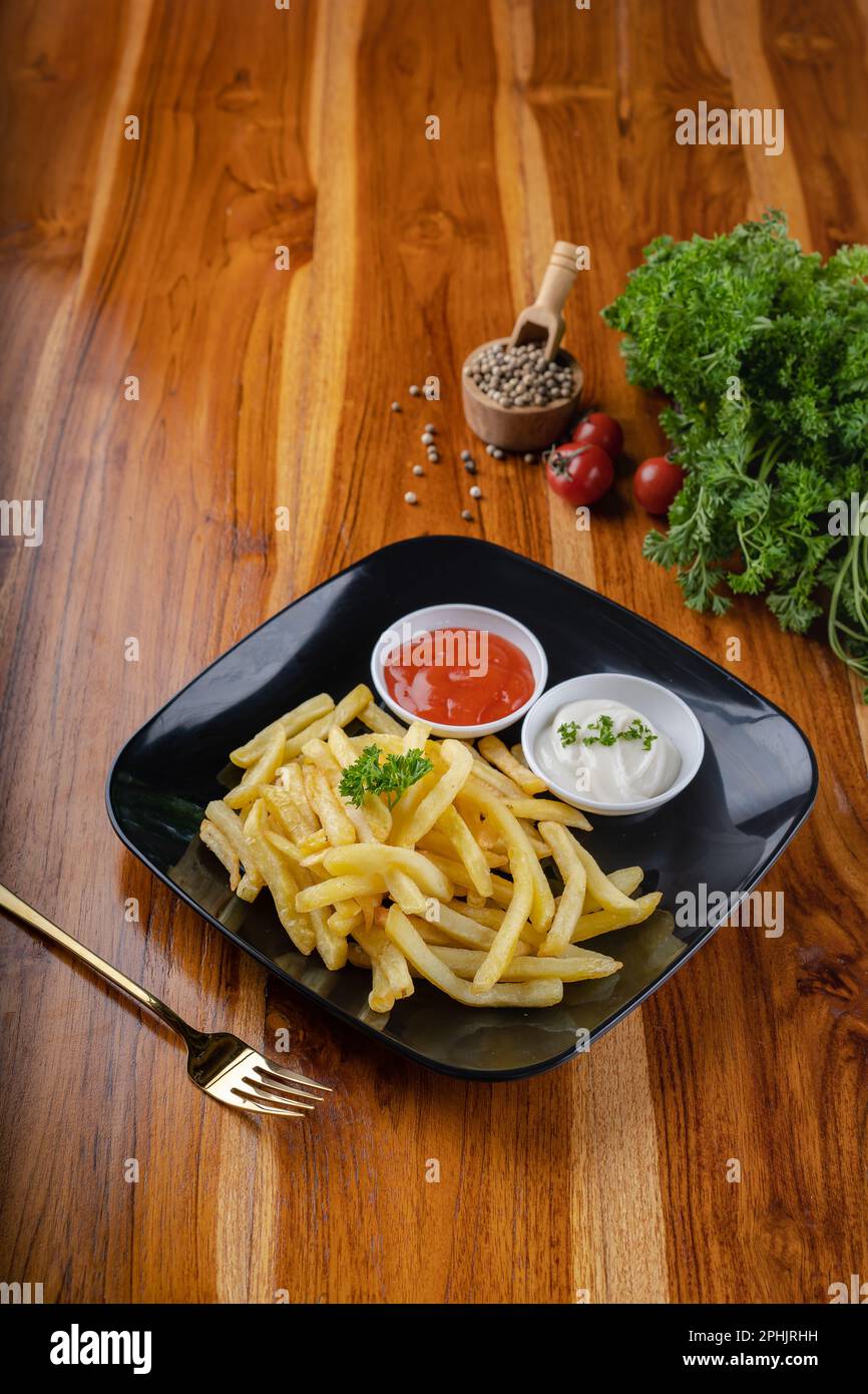 French fries or potato chips fries with mayonnaise sour cream and chili