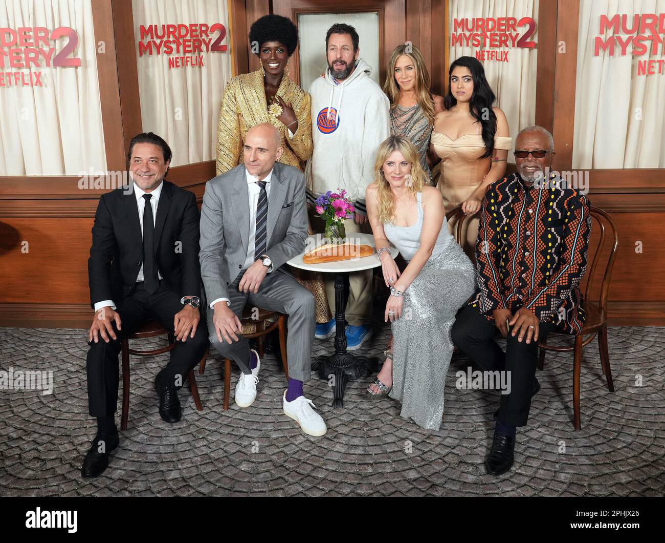 Los Angeles, USA. 28th Mar, 2023. (L-R) MURDER MYSTERY 2 Cast - Enrique  Arce, Jodie Turner-Smith, Mark Strong, Adam Sandler, Jennifer Aniston,  Mélanie Laurent, Kuhoo Verma and Dr. John Kani at the