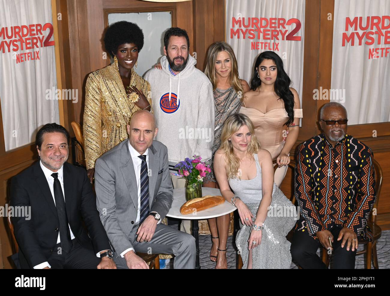 Los Angeles, USA. 28th Mar, 2023. MURDER MYSTERY 2 Cast & Crew - (Standing,  L-R) Jason Young, Ori Marmur, Zurin Villanueva, Ted Sarandos, Jodie  Turner-Smith, Adam Sandler, Scott Stuber, Jennifer Aniston, Jeremy