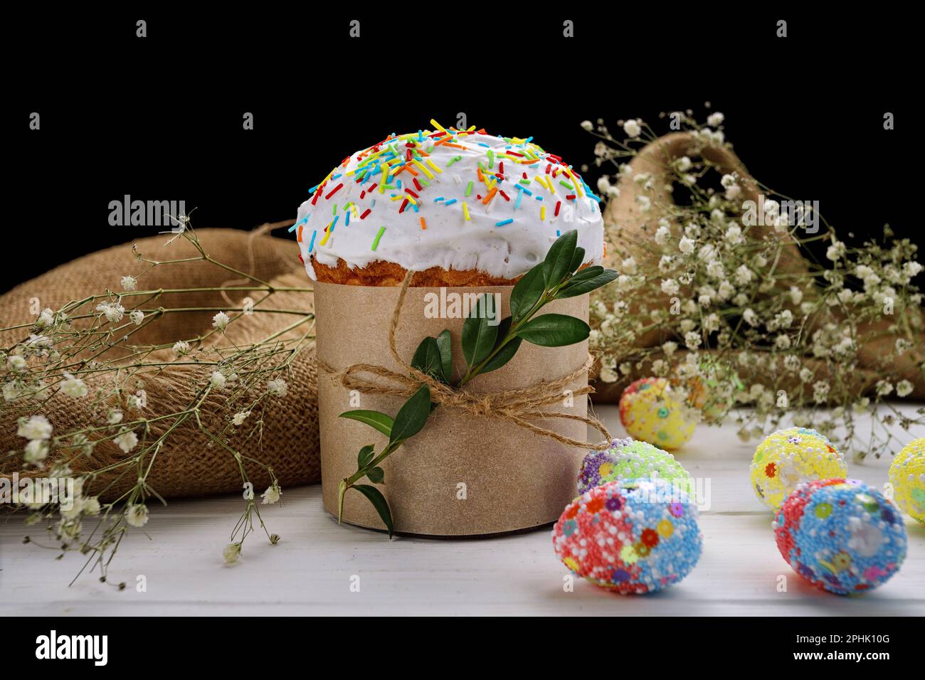 Traditional Easte Treat, Homemade Paska with Colorful Eggs Stock Photo
