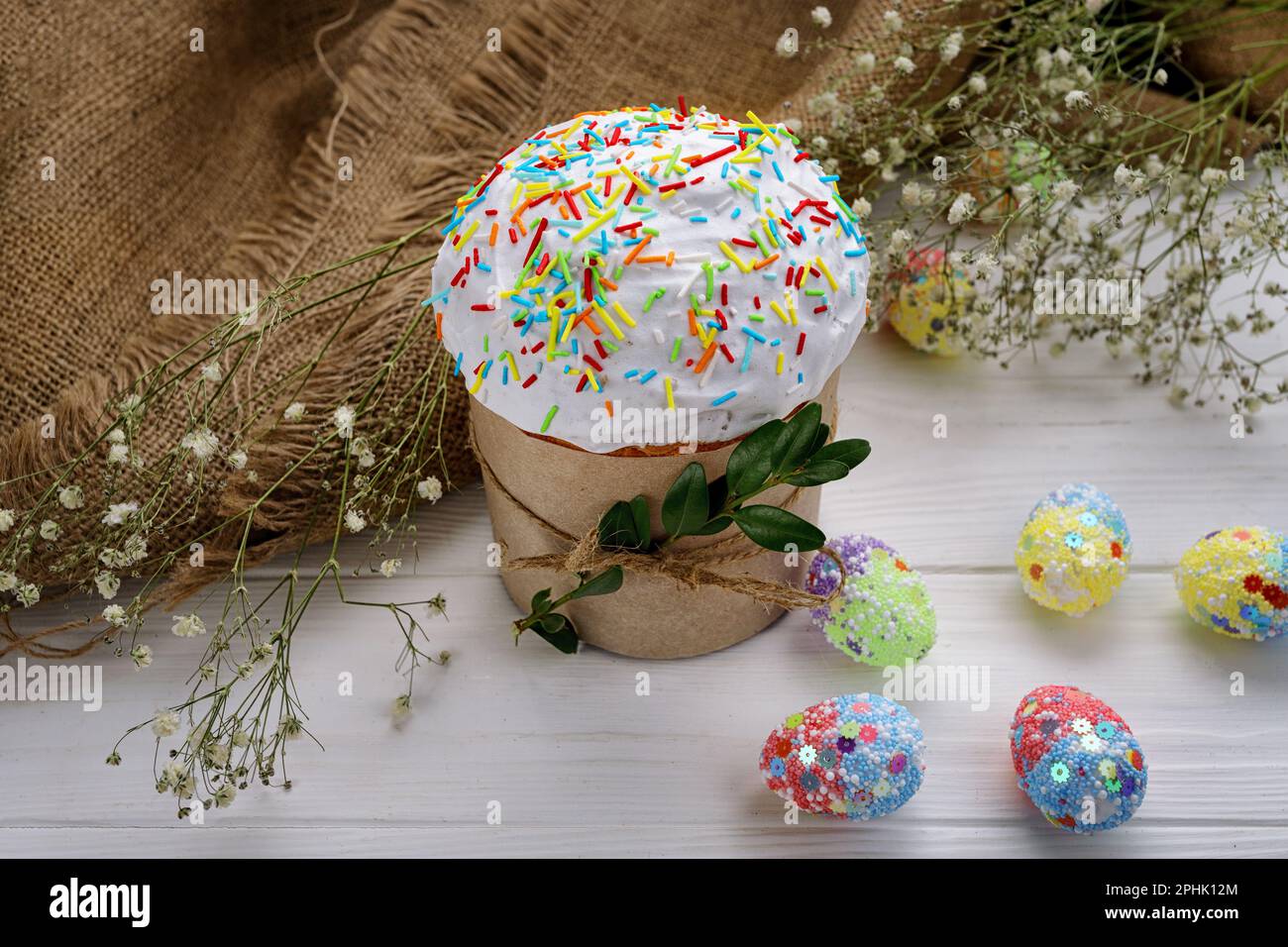 Traditional Easte Treat, Homemade Paska with Colorful Eggs Stock Photo