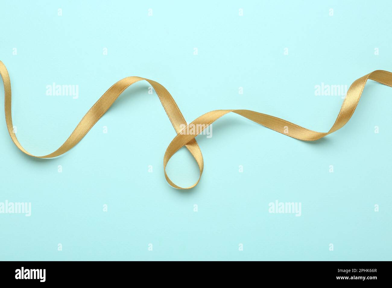 Golden ribbon on light hi-res stock photography and images - Alamy