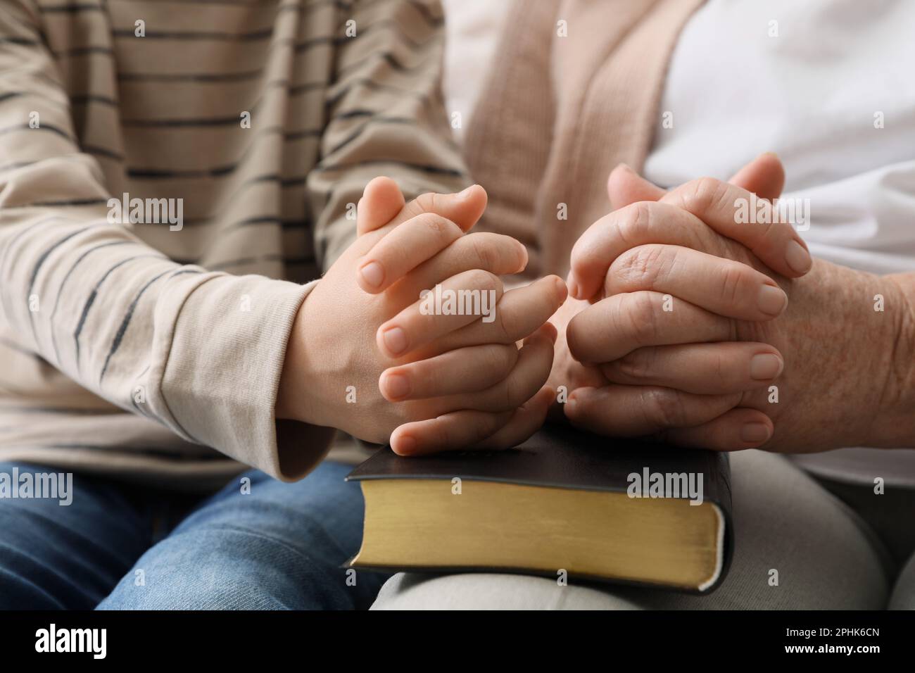 Adult child praying together hi-res stock photography and images - Alamy