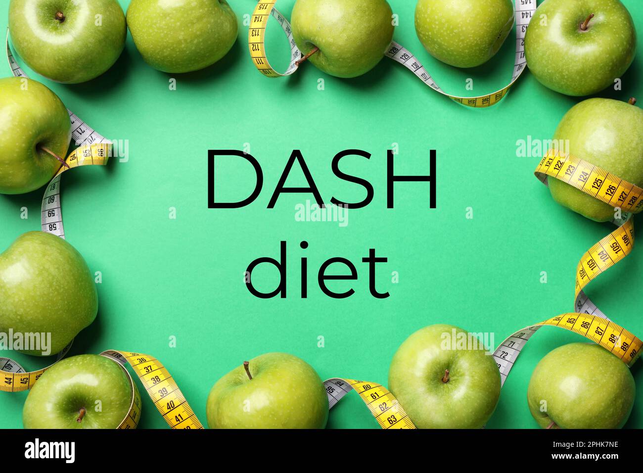 DASH diet to stop hypertension. Ripe apples and measuring tape on green