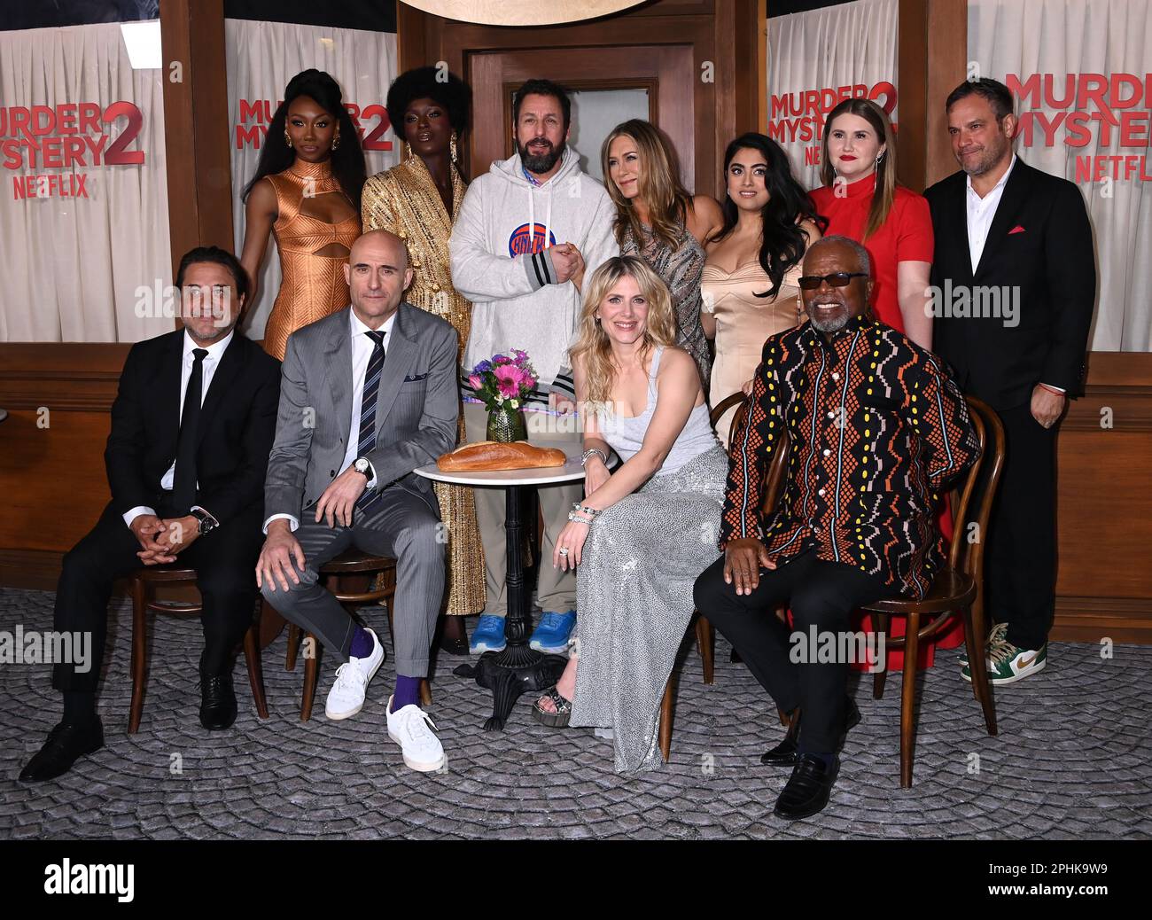 Los Angeles, USA. 28th Mar, 2023. (L-R) MURDER MYSTERY 2 Cast - Enrique  Arce, Jodie Turner-Smith, Mark Strong, Adam Sandler, Jennifer Aniston,  Mélanie Laurent, Kuhoo Verma and Dr. John Kani at the