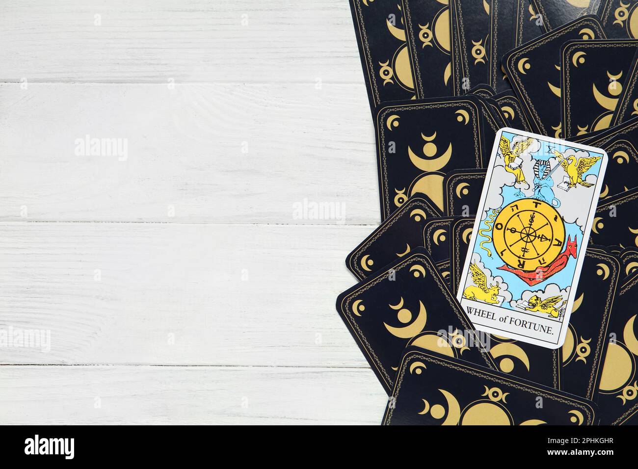 The Wheel of Fortune and other tarot cards on white wooden table, top view. Space for text Stock Photo