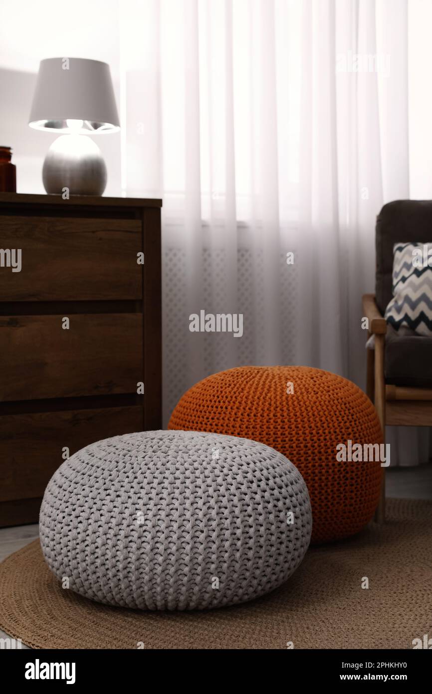 Stylish comfortable poufs in room. Home design Stock Photo Alamy