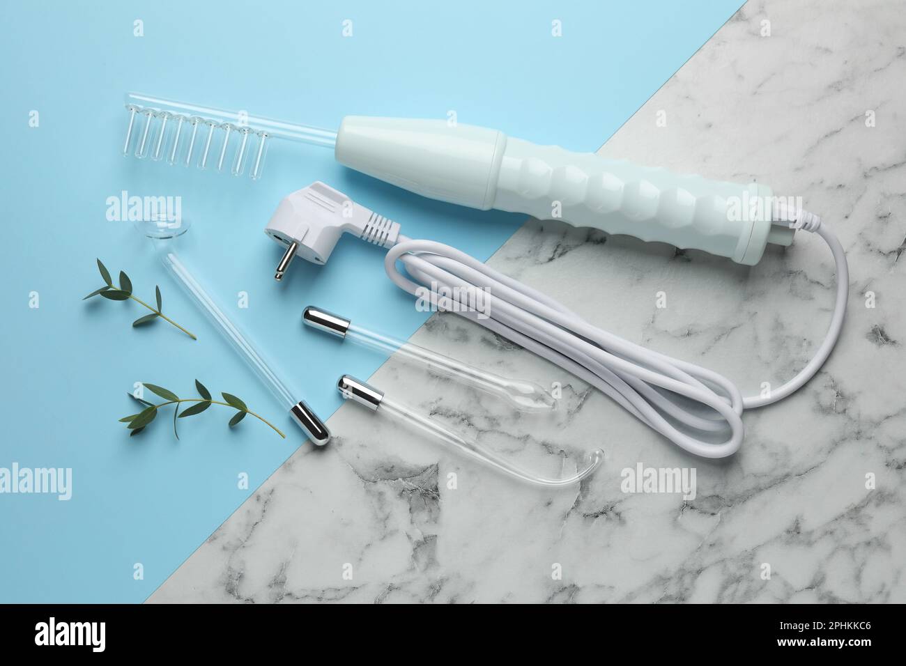 Flat lay composition with darsonval and different nozzles on color ...