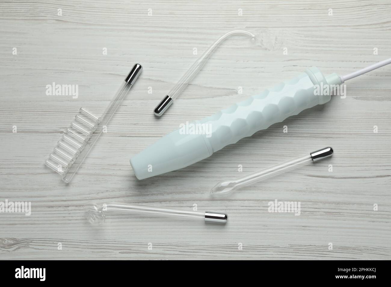 Darsonval and different nozzles on white wooden table, flat lay Stock ...