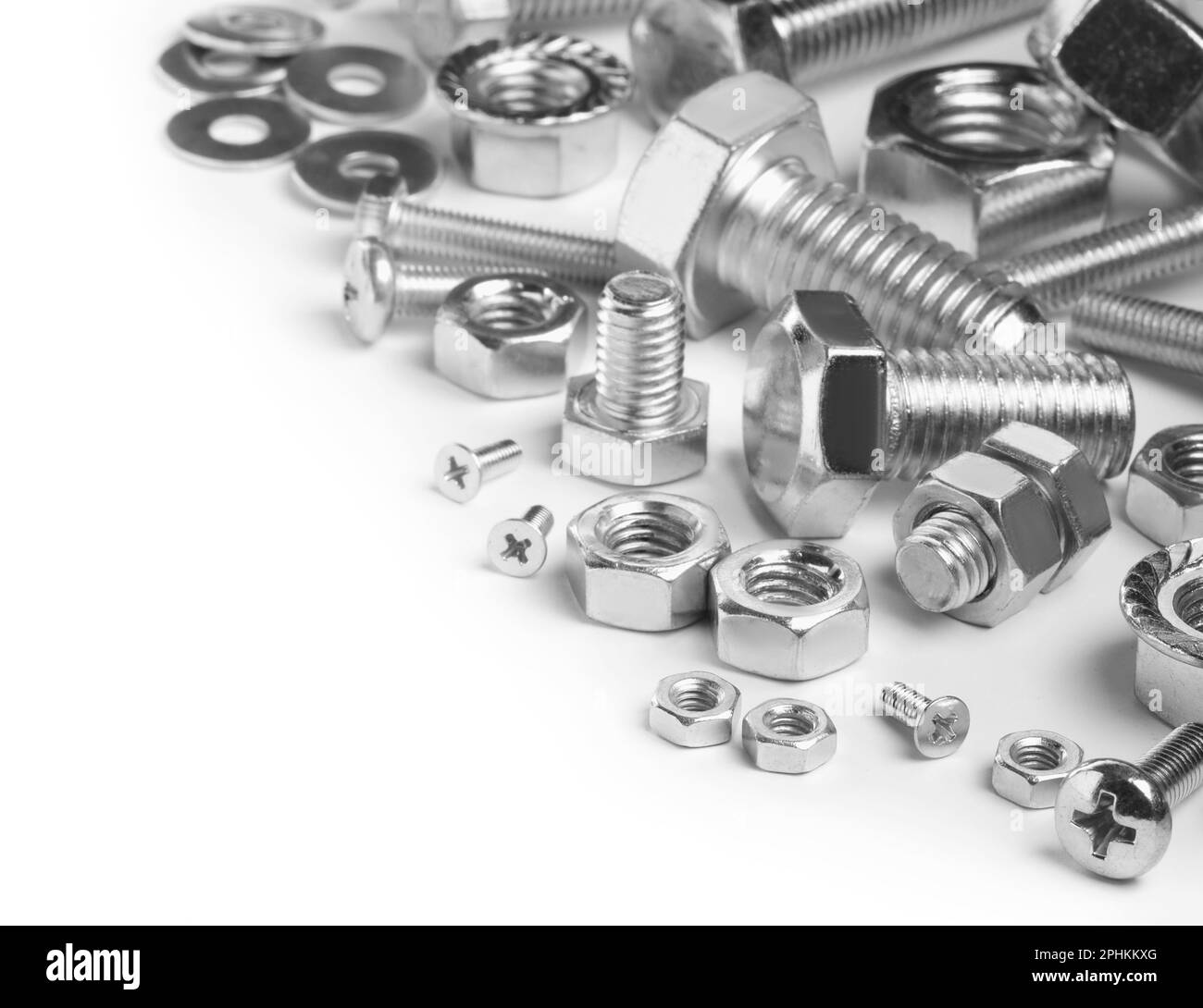 Different metal bolts and nuts on white background Stock Photo Alamy